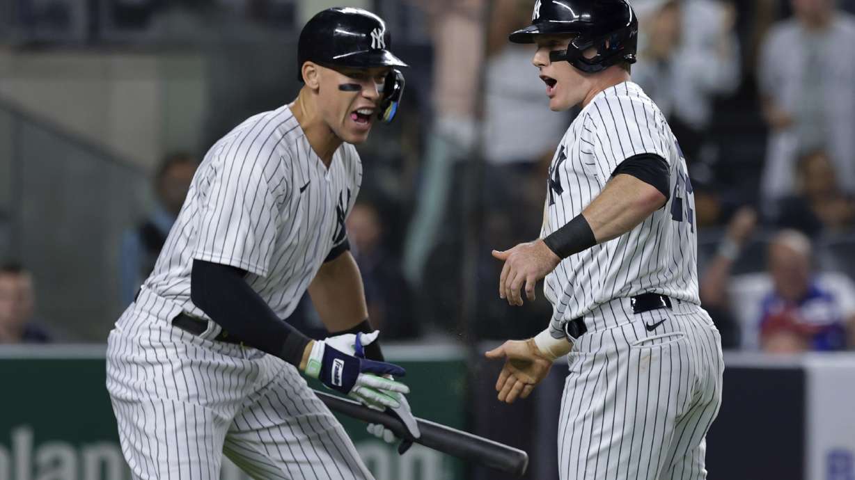 New York Yankees' Harrison Bader celebrates Aaron Judge after scoring against the Pittsburgh Pirates during the fifth inning of a baseball game Tuesday, Sept. 20, 2022, in New York.