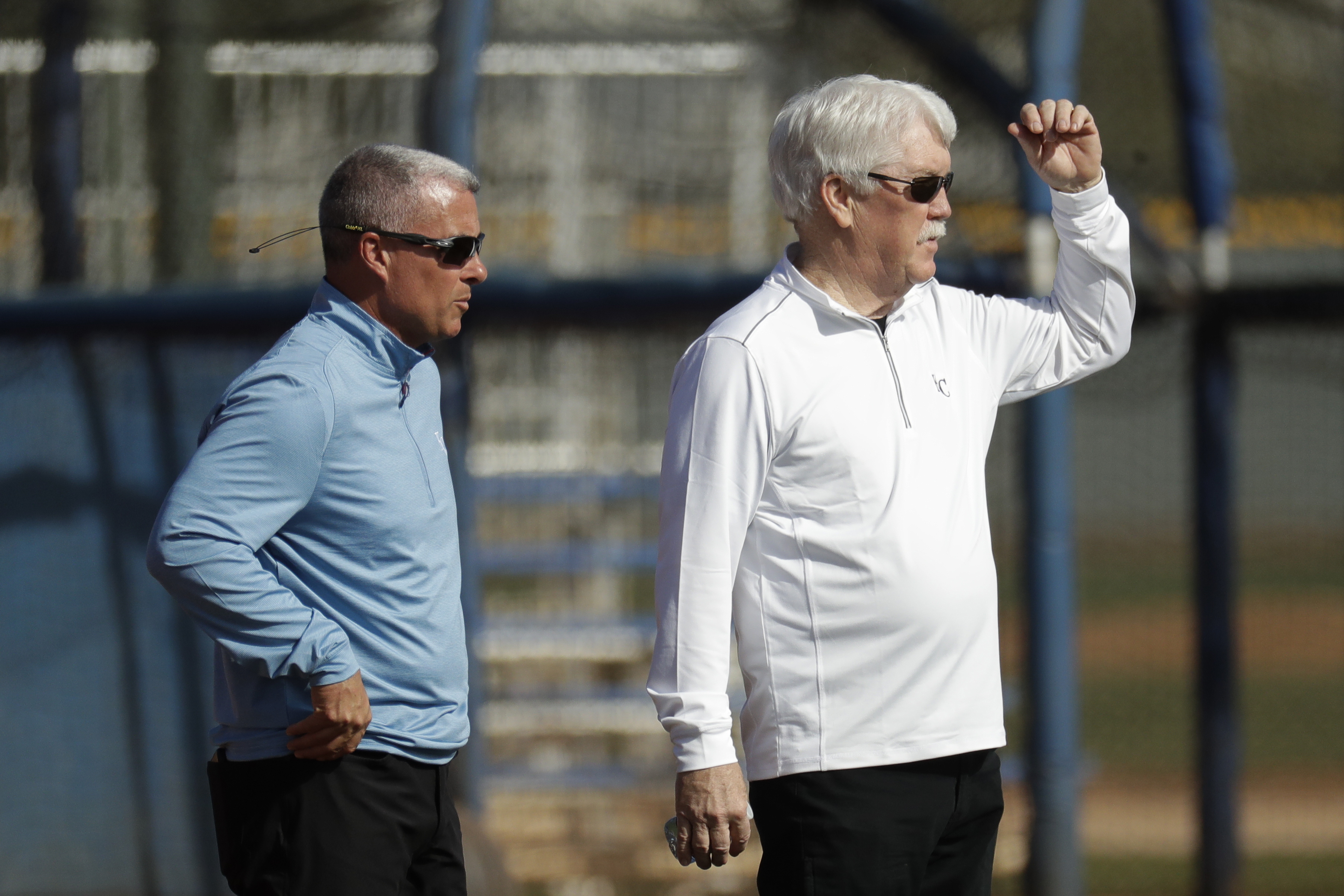 FILE - Kansas City Royals general manager Dayton Moore, left, and owner John Sherman watch a drill during spring training baseball practice Wednesday, Feb. 19, 2020, in Surprise, Ariz. The Kansas City Royals, Wednesday, Sept. 21, 2022, fired longtime general manager Dayton Moore. Royals owner John Sherman, who had retained Moore after acquiring the club from David Glass in 2019, announced the decision in a news conference that Moore attended at Kauffman Stadium on Wednesday. 