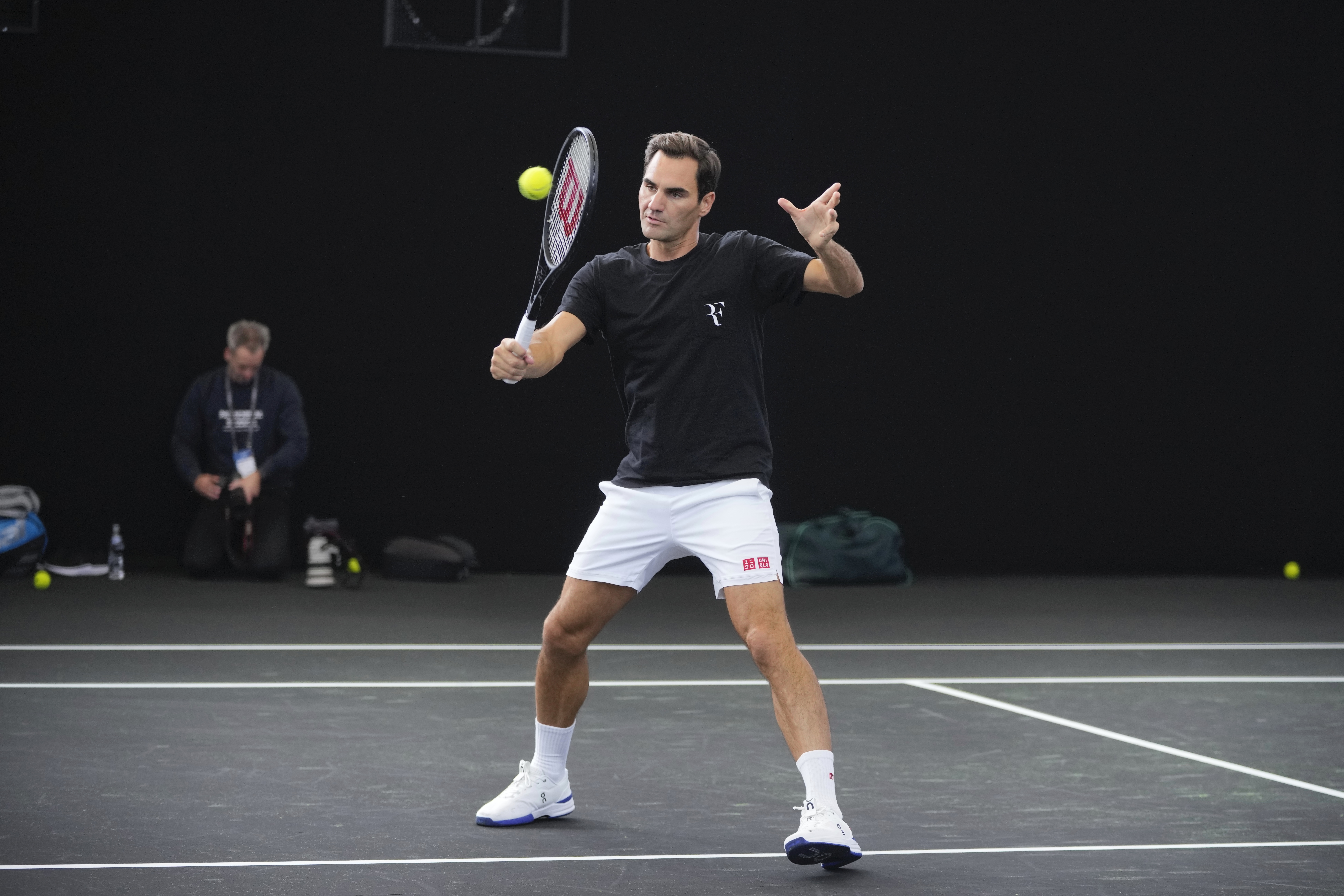 Switzerland's Roger Federer attends a training session ahead of the Laver Cup tennis tournament at the O2 in London, Wednesday, Sept. 21, 2022. Federer appeared earlier at a news conference to discuss his retirement from professional tennis at age 41 after a series of knee operations. He will close his career with a doubles match at the Laver Cup on Friday  . 