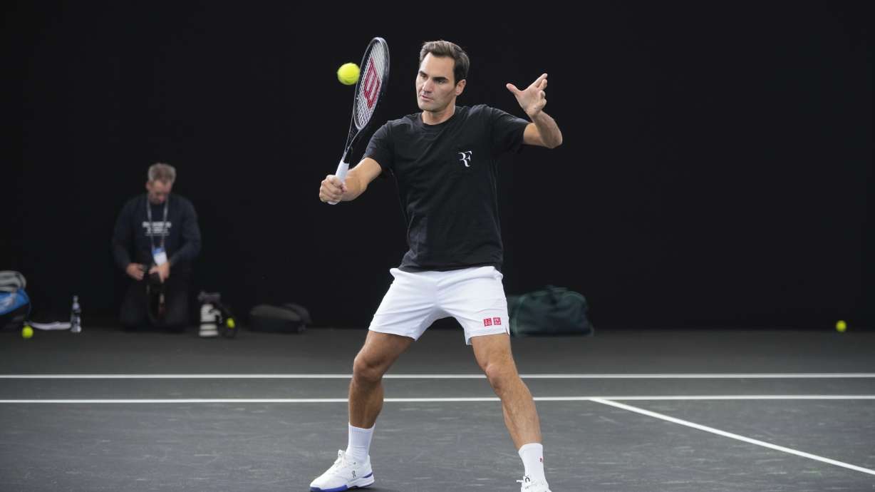 Switzerland's Roger Federer attends a training session ahead of the Laver Cup tennis tournament at the O2 in London, Wednesday, Sept. 21, 2022. Federer appeared earlier at a news conference to discuss his retirement from professional tennis at age 41 after a series of knee operations. He will close his career with a doubles match at the Laver Cup on Friday .