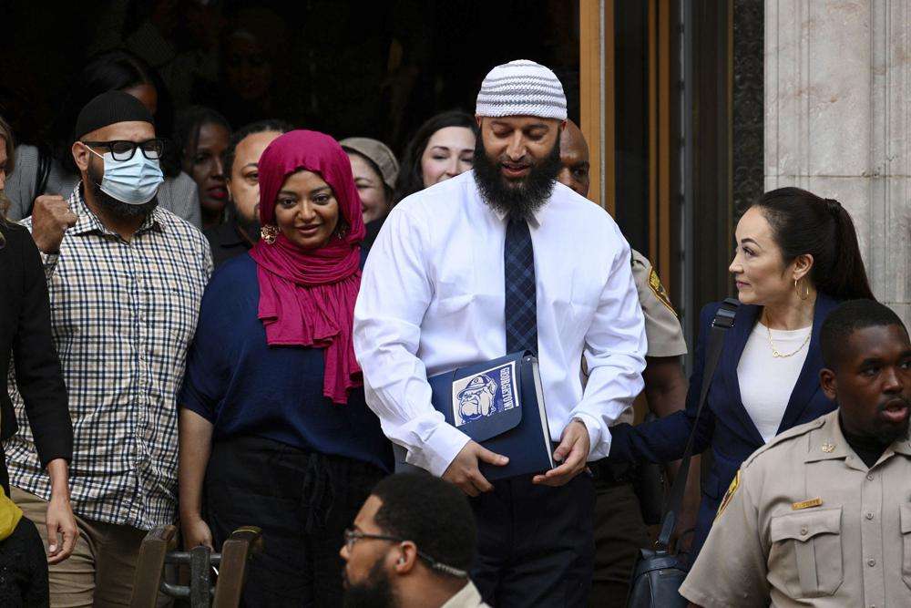 Adnan Syed, center right, leaves the courthouse after the hearing, Monday, in Baltimore. A Baltimore judge on Monday ordered the release of Syed after overturning his conviction for the 1999 murder of high school student Hae Min Lee — a case that was chronicled in the hit podcast “Serial,” a true-crime series that transfixed listeners and revolutionized the genre.