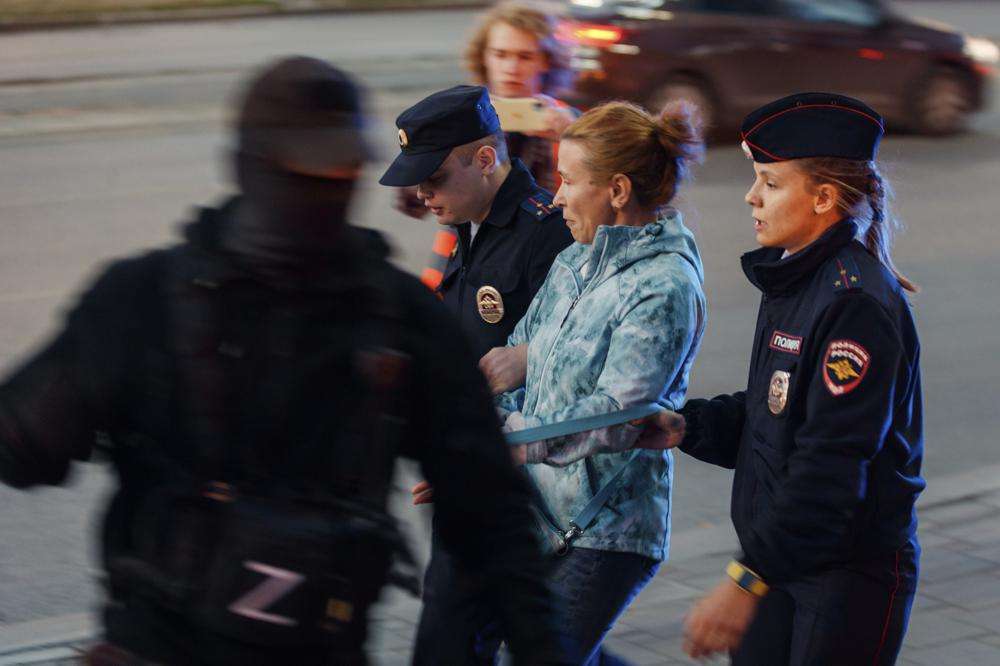 Police detain demonstrators during a protest against mobilization in Yekaterinburg, Russia, Wednesday. Russian President Vladimir Putin has ordered a partial mobilization of reservists in Russia, effective immediately.