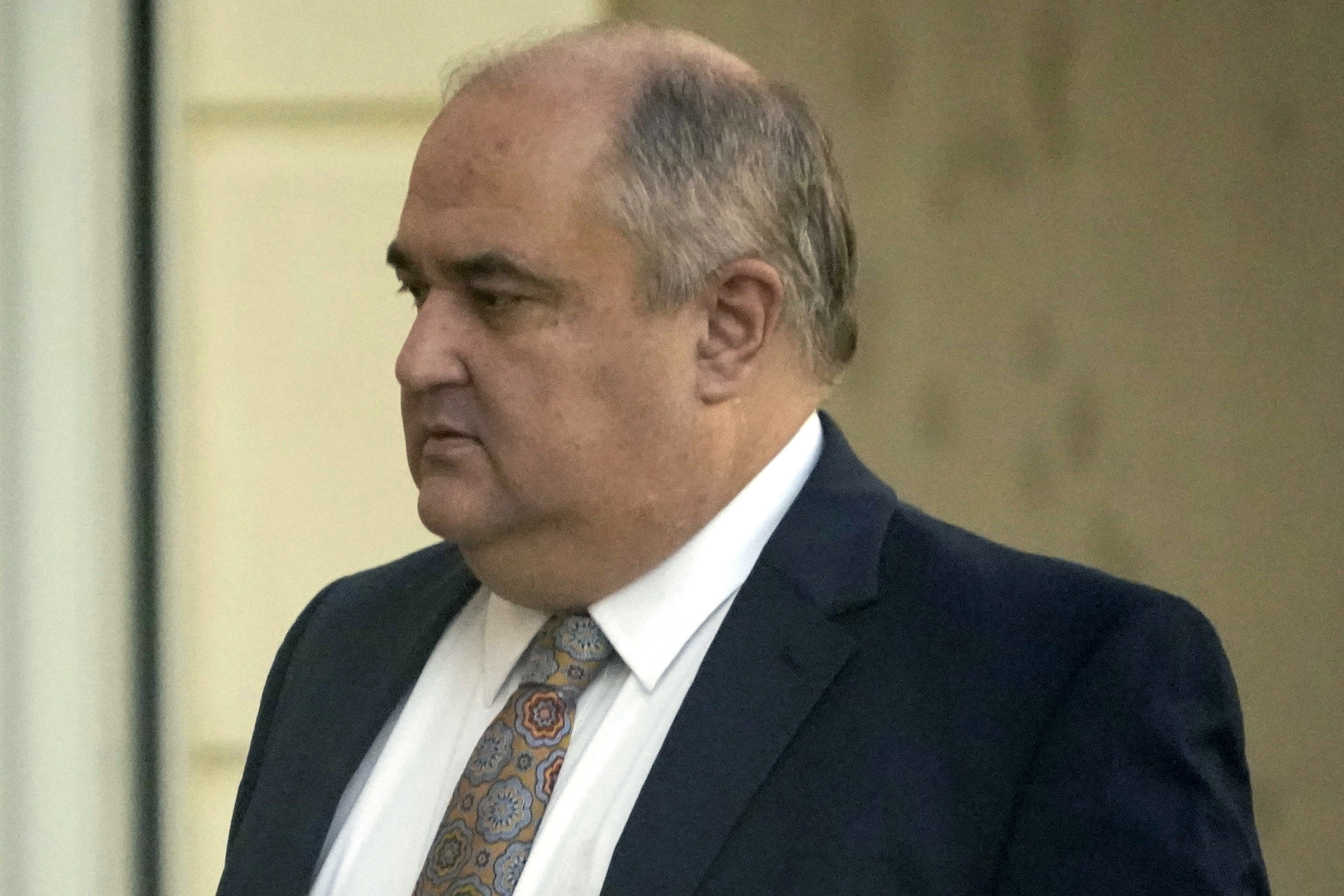 John Davis, former director of the Mississippi Department of Human Services, enters the Thad Cochran United States Courthouse in Jackson, Miss., Thursday, Sept. 22, 2022, where he is set to plead guilty to new federal charges in a conspiracy to misspend tens of millions of dollars that were intended to help needy families.  