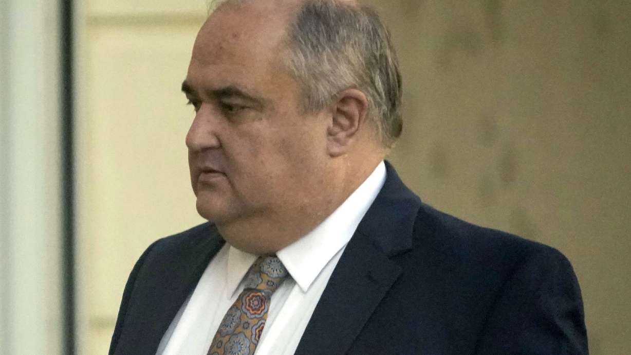 John Davis, former director of the Mississippi Department of Human Services, enters the Thad Cochran United States Courthouse in Jackson, Miss., Thursday, Sept. 22, 2022, where he is set to plead guilty to new federal charges in a conspiracy to misspend tens of millions of dollars that were intended to help needy families.