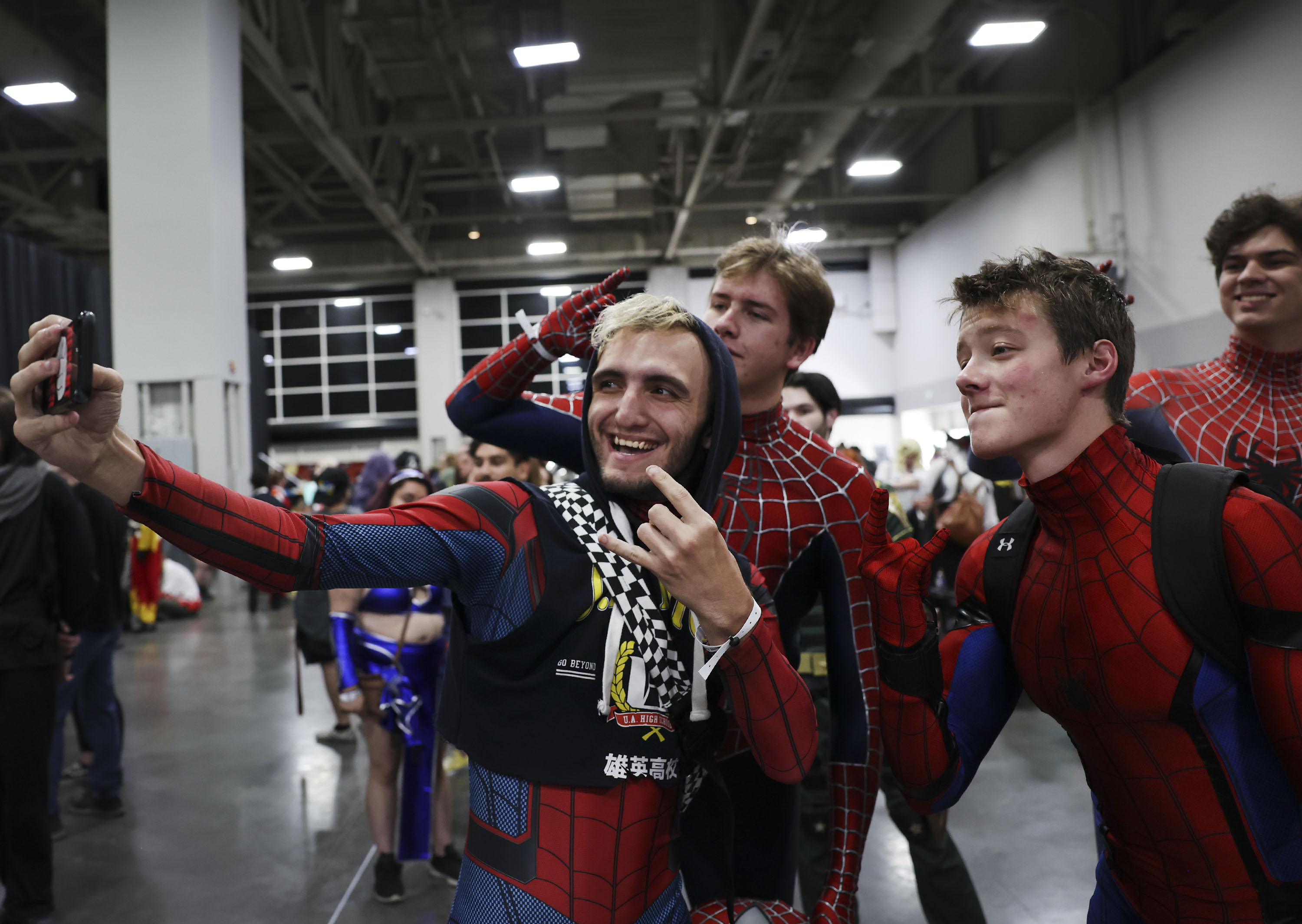 A group of Spidermen take a selfie at the FanX convention at the Salt Palace Convention Center in Salt Lake City on Sept. 22, 2022. The annual Salt Lake comic and pop culture convention begins Thursday and runs through Saturday.