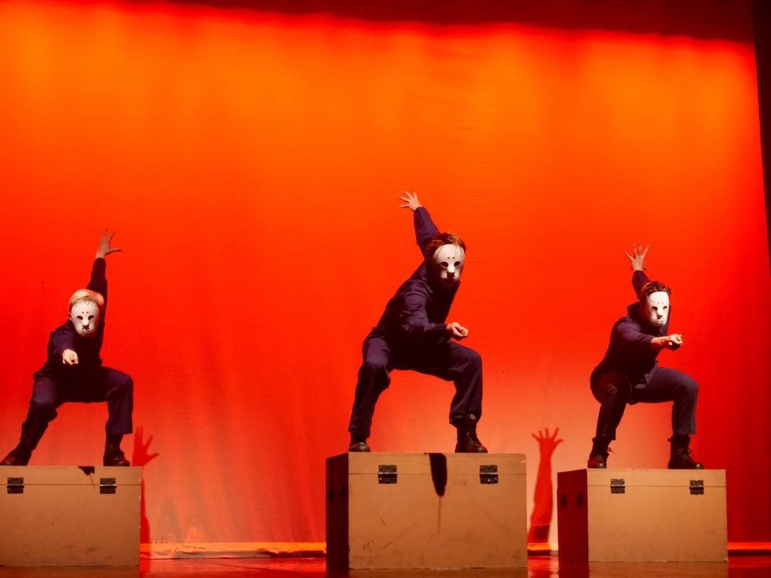 Dancers jump onto a box and strike a pose in the dance "Jason Jam" during dress rehearsal for Odyssey Dance Theatre's "Thriller" on Sept. 22, 2022.