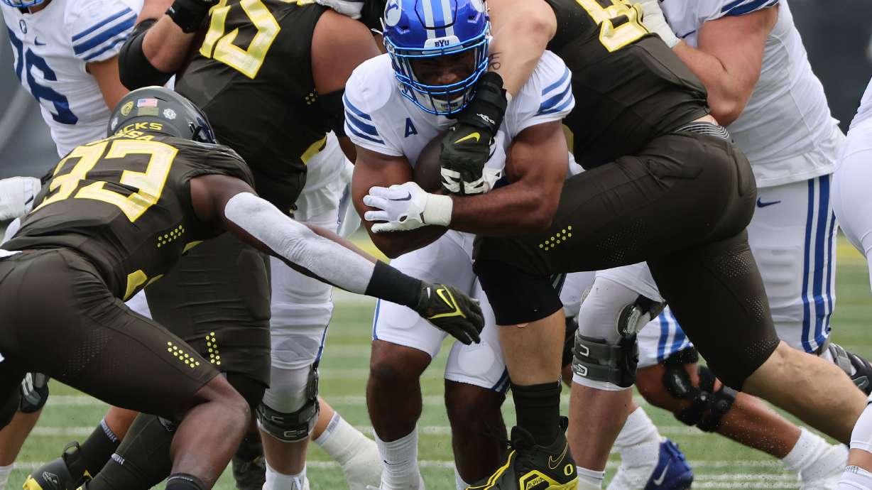 Brigham Young running back Christopher Brooks (2) runs against the Oregon Ducks at Autzen Stadium in Eugene on Saturday, Sept. 17, 2022.