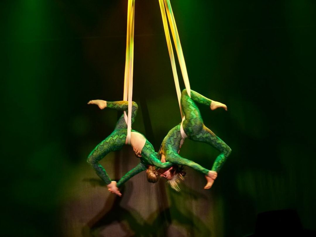 Two dancers perform "Slytherins," an acrobatic piece using aerial silks, during a dress rehearsal for Odyssey Dance Theatre's "Thriller" on Thursday.