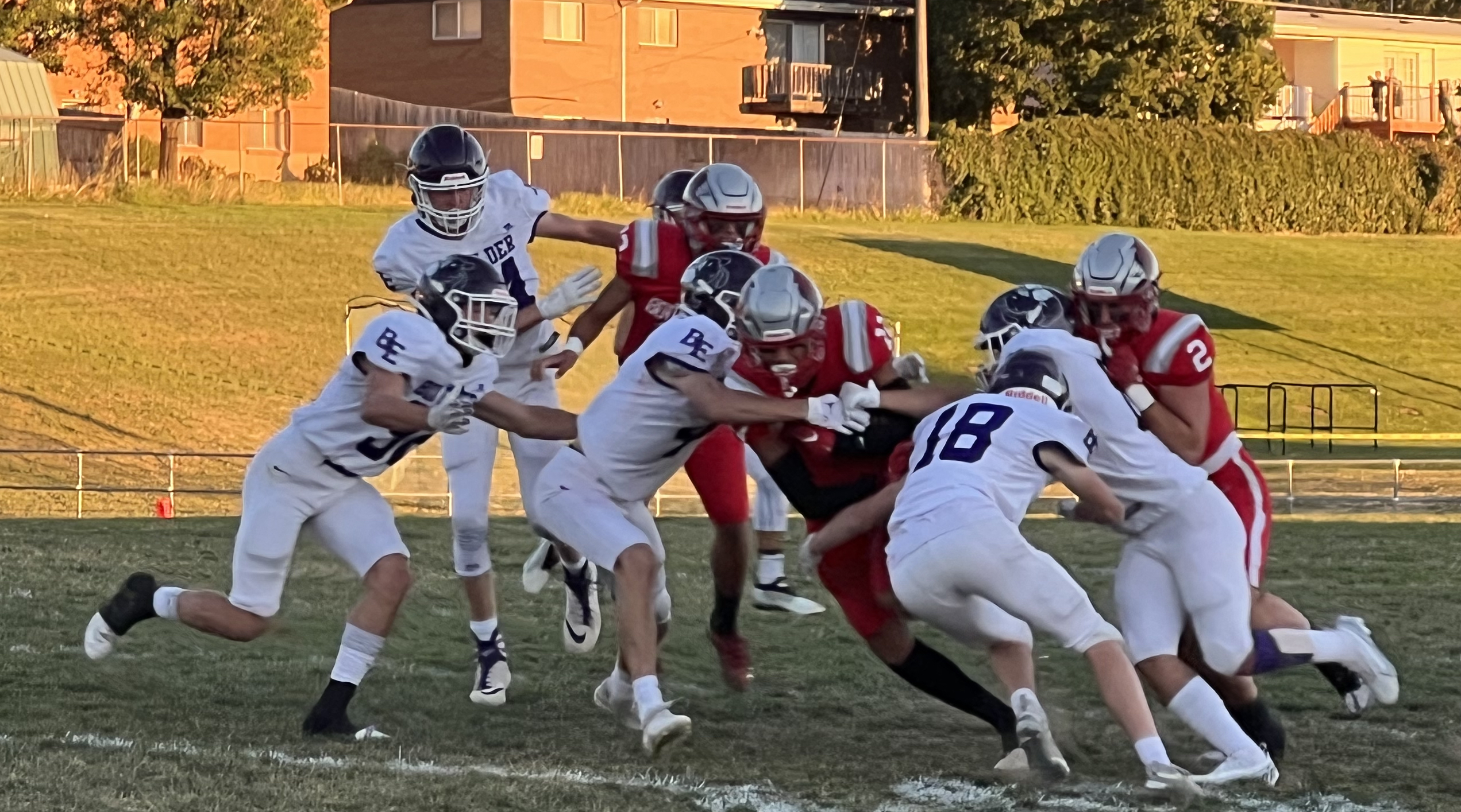 Bountiful quarterback Owen Geilman is taken down by Box Elder defenders Friday.