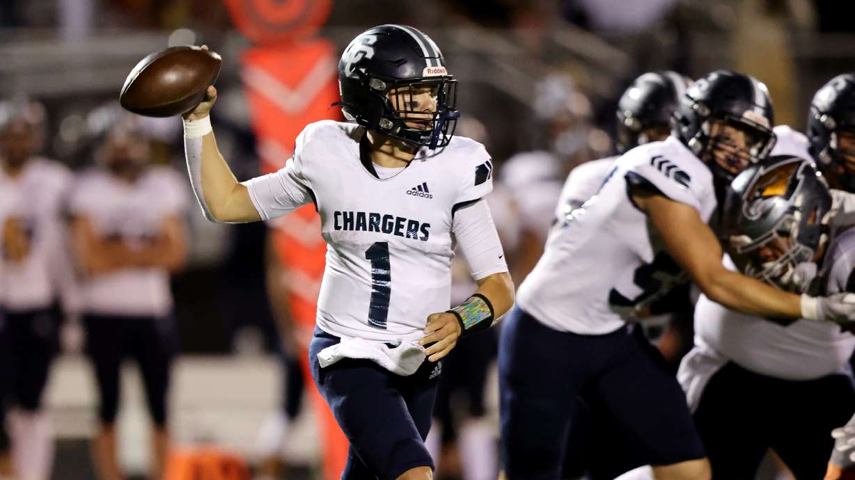 Corner Canyon’s Isaac Wilson, looks to pass as Skyridge and Corner Canyon play a football game in Lehi on Friday, Sept. 23, 2022. Corner Canyon won 21-17.