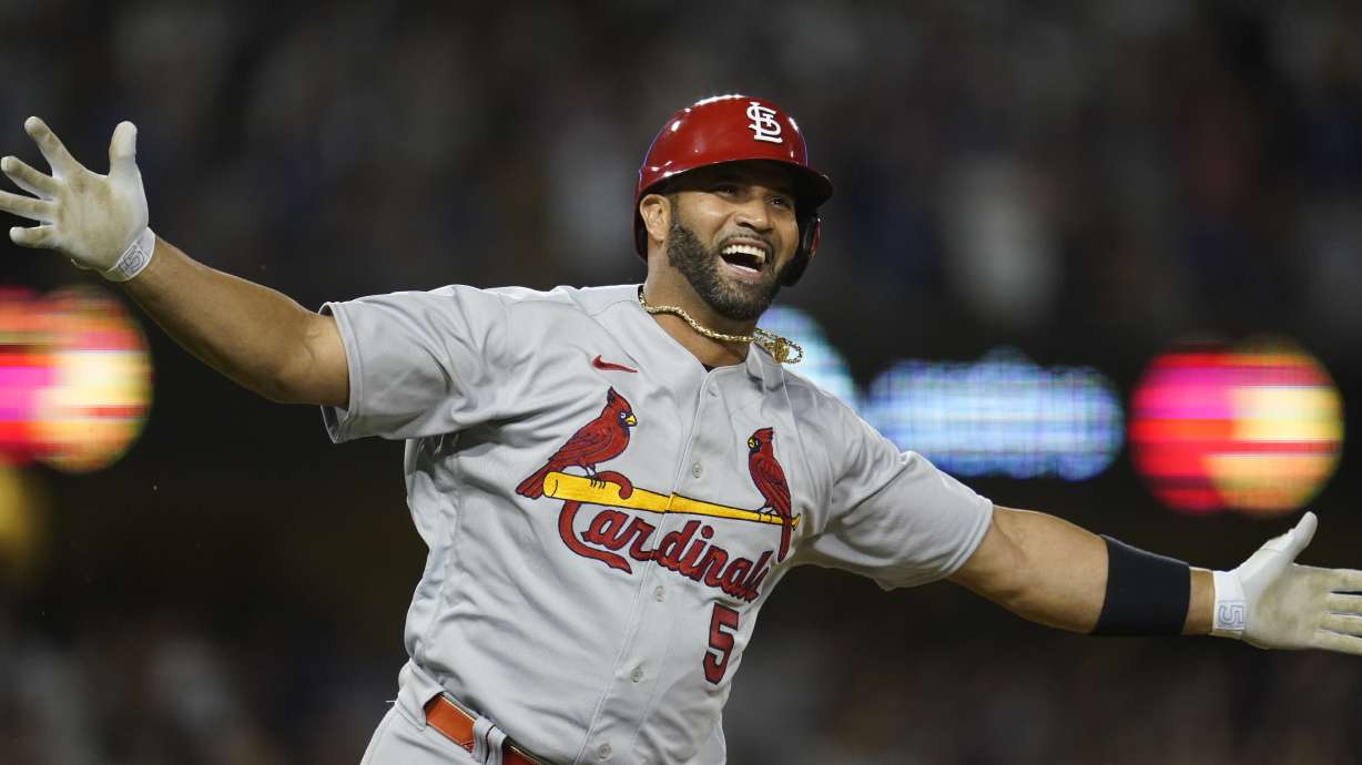 St. Louis Cardinals designated hitter Albert Pujols (5) watches after hitting a home run during the fourth inning of a baseball game against the Los Angeles Dodgers in Los Angeles, Friday, Sept. 23, 2022. Brendan Donovan and Tommy Edman also scored. It was Pujols' 700th career home run.