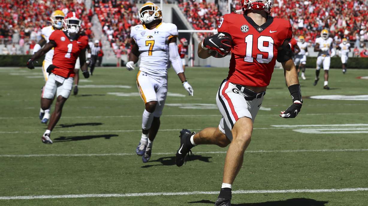 Georgia tight end Brock Bowers breaks away from Kent State safety Antwaine Richardson on a 70-plus yard touchdown during an NCAA college football game Saturday, Sept. 24, 2022 ,in Athens Ga.