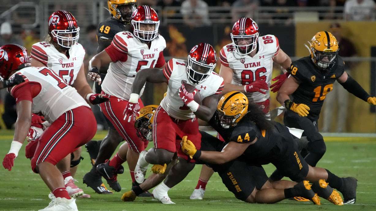 Utah running back Jaylon Glover (1) runs past Arizona State defensive lineman Tautala Pesefea Jr. (44) during the first half of an NCAA college football game Saturday, Sept. 24, 2022, in Tempe, Ariz.