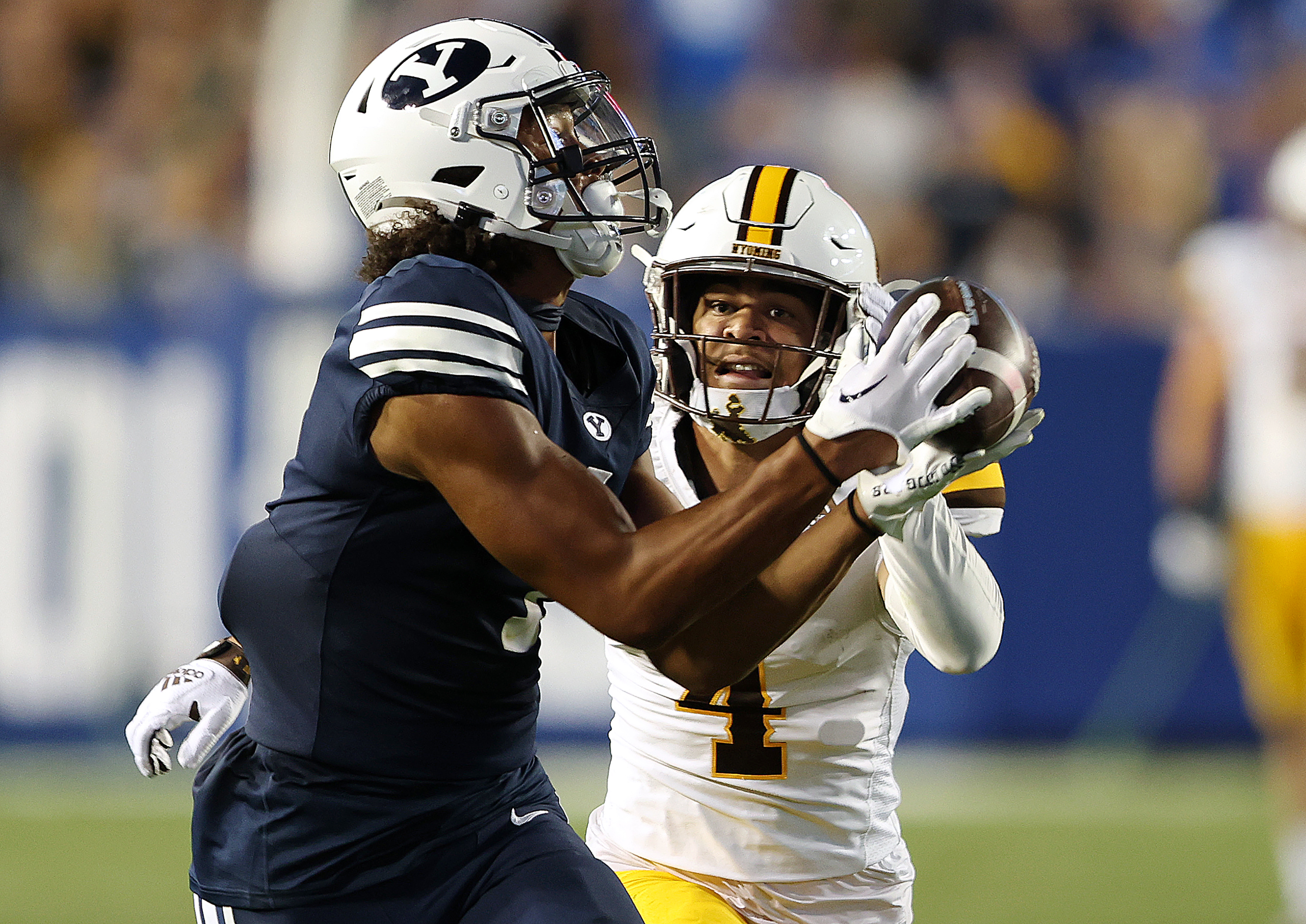 Brigham Young wide receiver Keanu Hill (1) makes a catch over Wyoming cornerback Cameron Stone (4) and battles for the touchdown as BYU and Wyoming play at LaVell Edwards Stadium in Provo on Saturday, Sept. 24, 2022. BYU won 38-24.