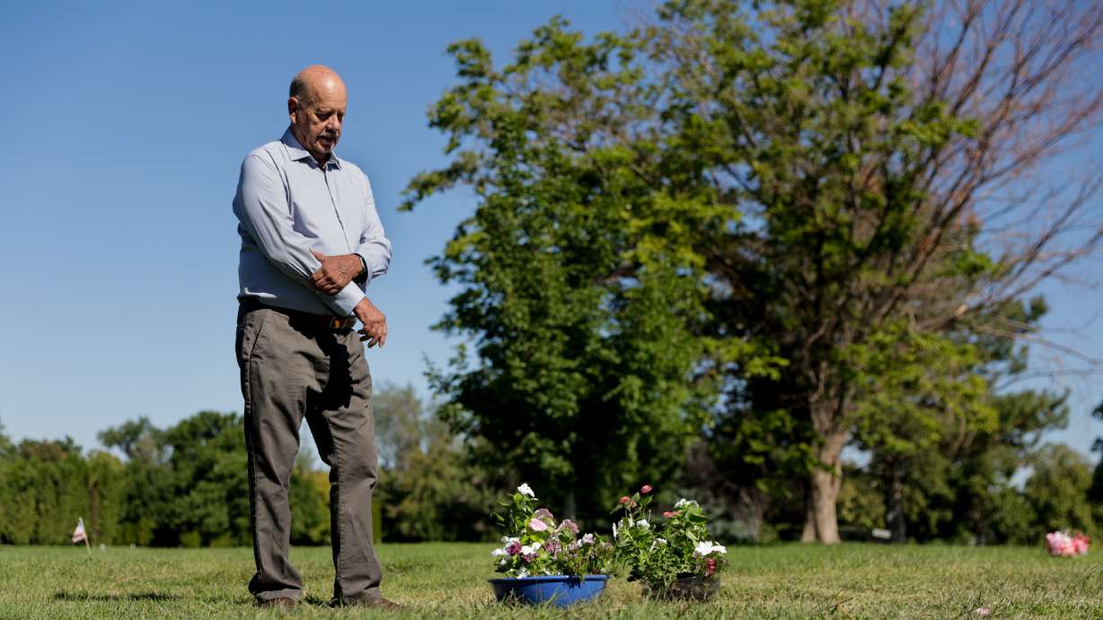 Ron Snarr stands next to his sons' graves at Wasatch Lawn Memorial Park and Mortuary in Millcreek on Sunday, Aug. 28. Snarr’s sons, Levi and Zachary, are buried next to one another.