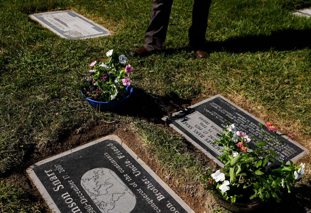 Ron Snarr looks at his sons' graves at Wasatch Lawn Memorial Park and Mortuary in Millcreek on Sunday, Aug. 28. Snarr’s sons, Levi and Zachary, are buried next to one another.
