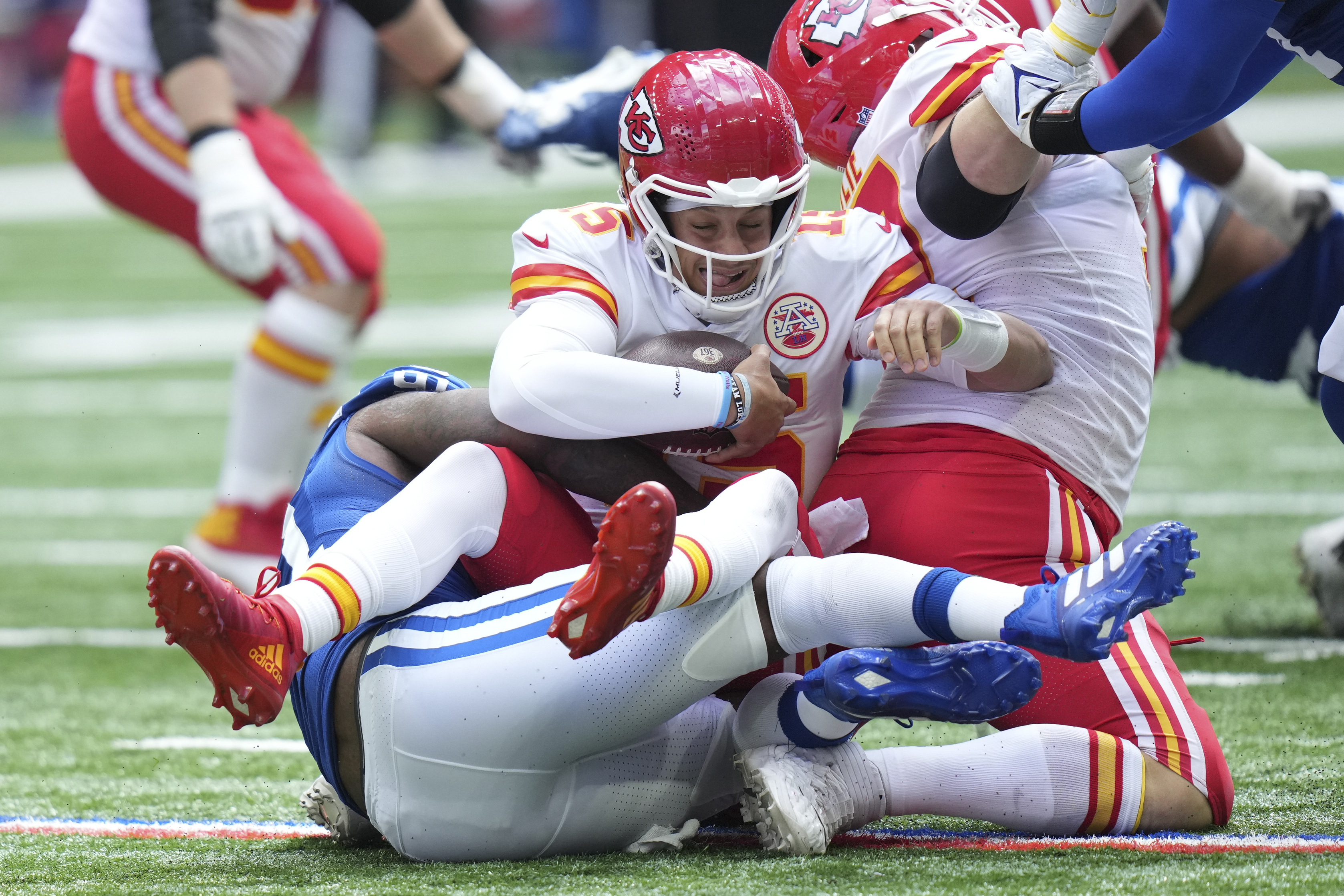Kansas City Chiefs quarterback Patrick Mahomes (15) is sacked by Indianapolis Colts defensive end Yannick Ngakoue (91) during the first half of an NFL football game, Sunday, Sept. 25, 2022, in Indianapolis. 