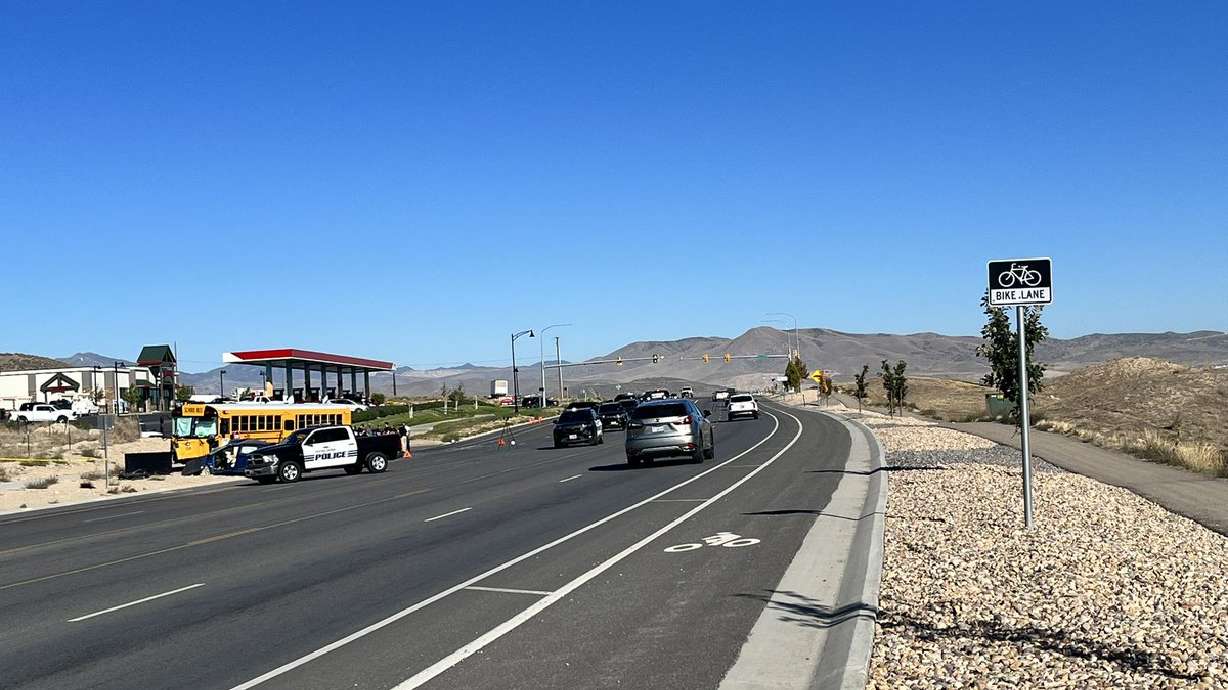 A passenger in a car was killed early Monday in a crash involving a school bus in Saratoga Springs, police said.