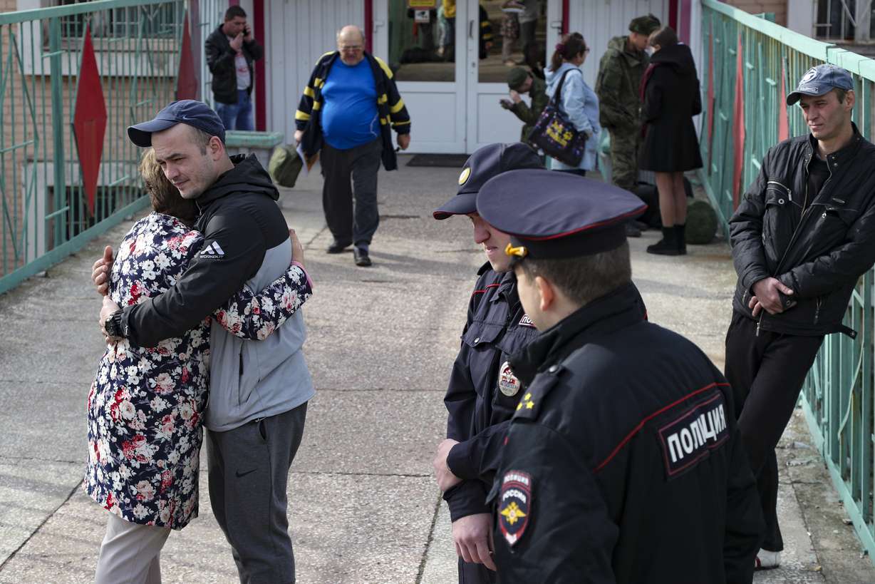 A Russian recruit hugs his mother at a military recruitment center in Volgograd, Russia, Saturday. Russian President Vladimir Putin on Wednesday ordered a partial mobilization of reservists to beef up his forces in Ukraine.