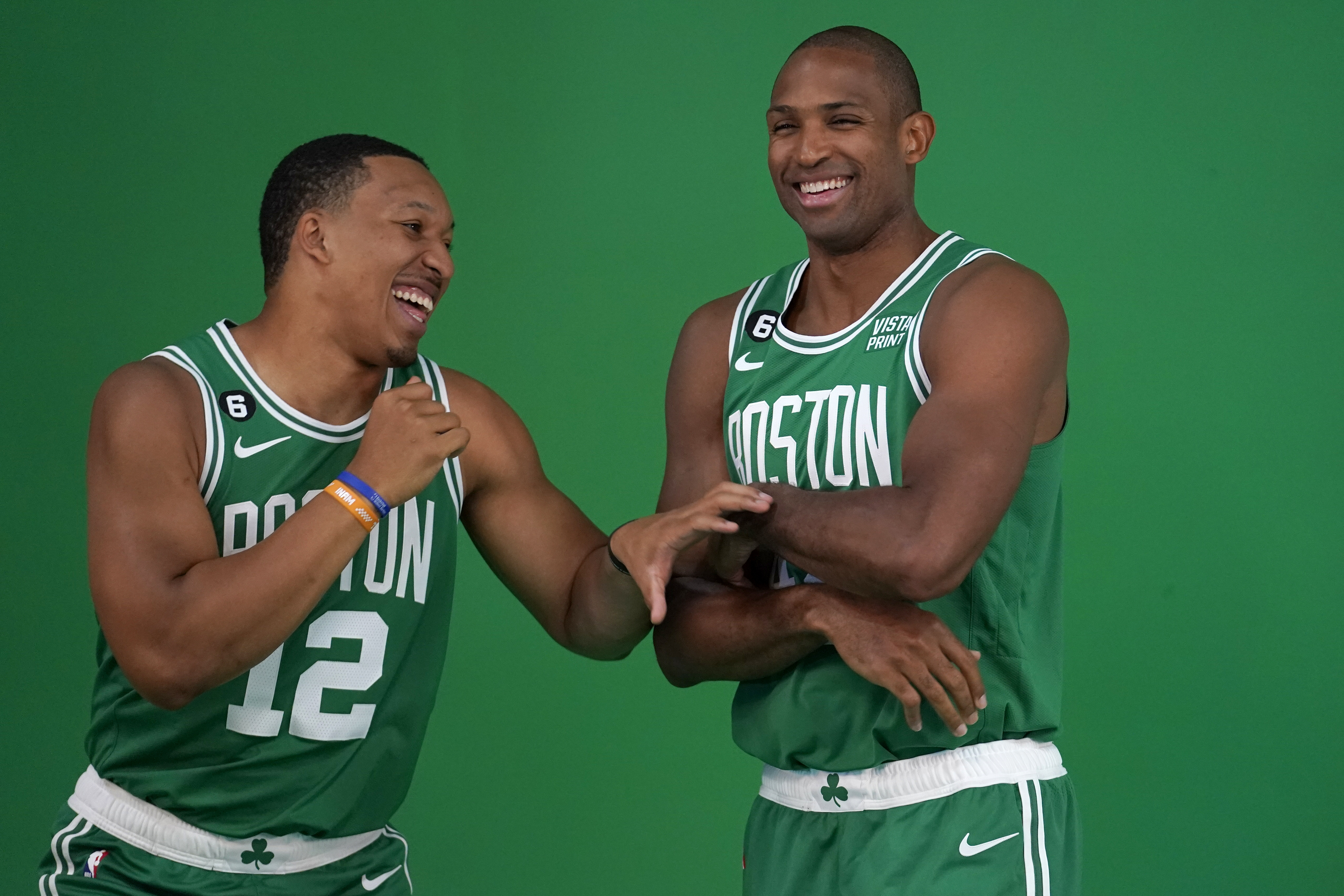 Boston Celtics forward Grant Williams, left, jokes with center Al Horford, right, as the NBA basketball players stand for photos during the team's Media Day, Monday, Sept. 26, 2022, in Canton, Mass. 