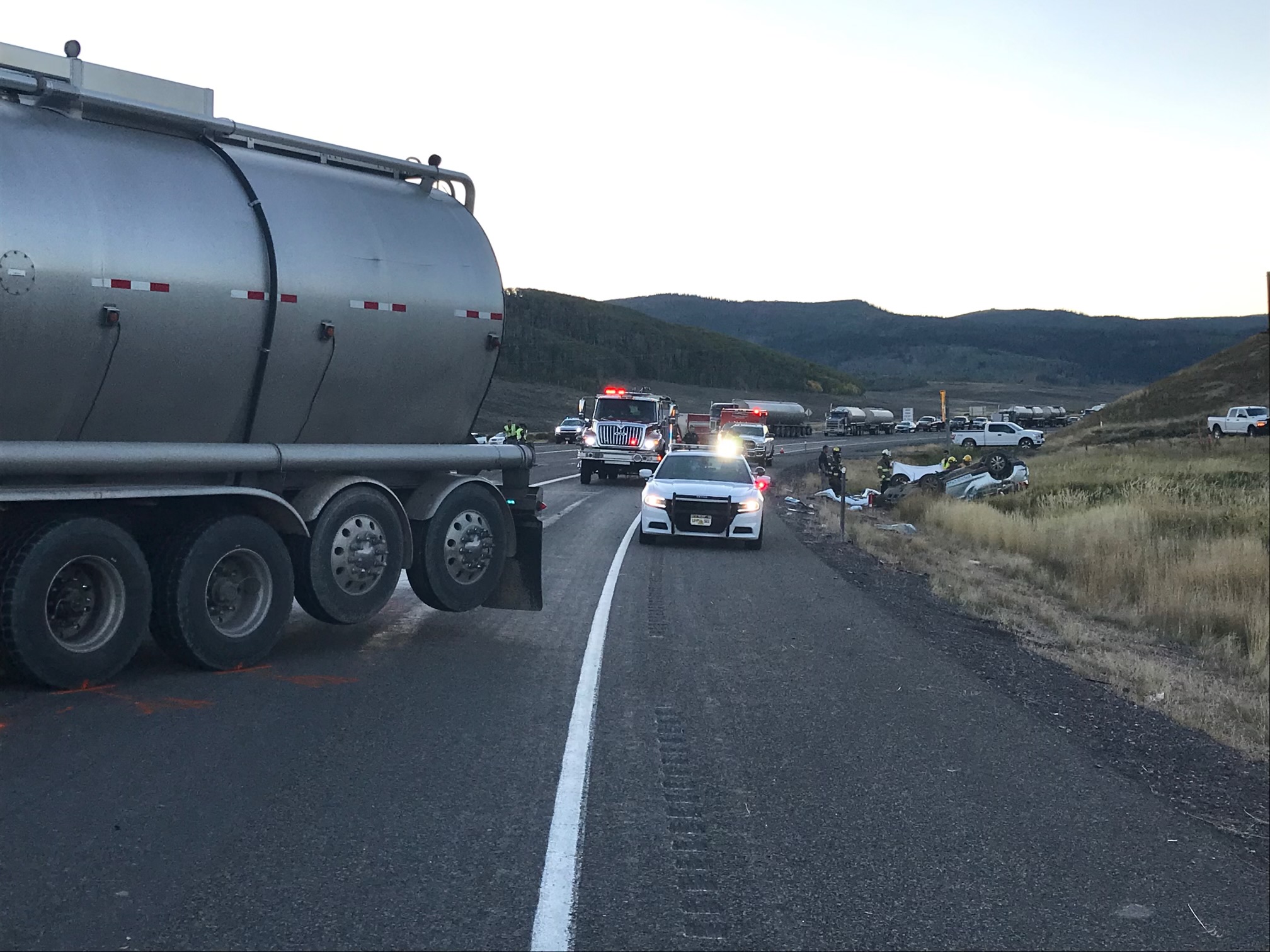 A woman was killed and a man is in critical condition after their vehicle turned in front of a semitruck near Strawberry Reservoir on Monday afternoon, state troopers said.