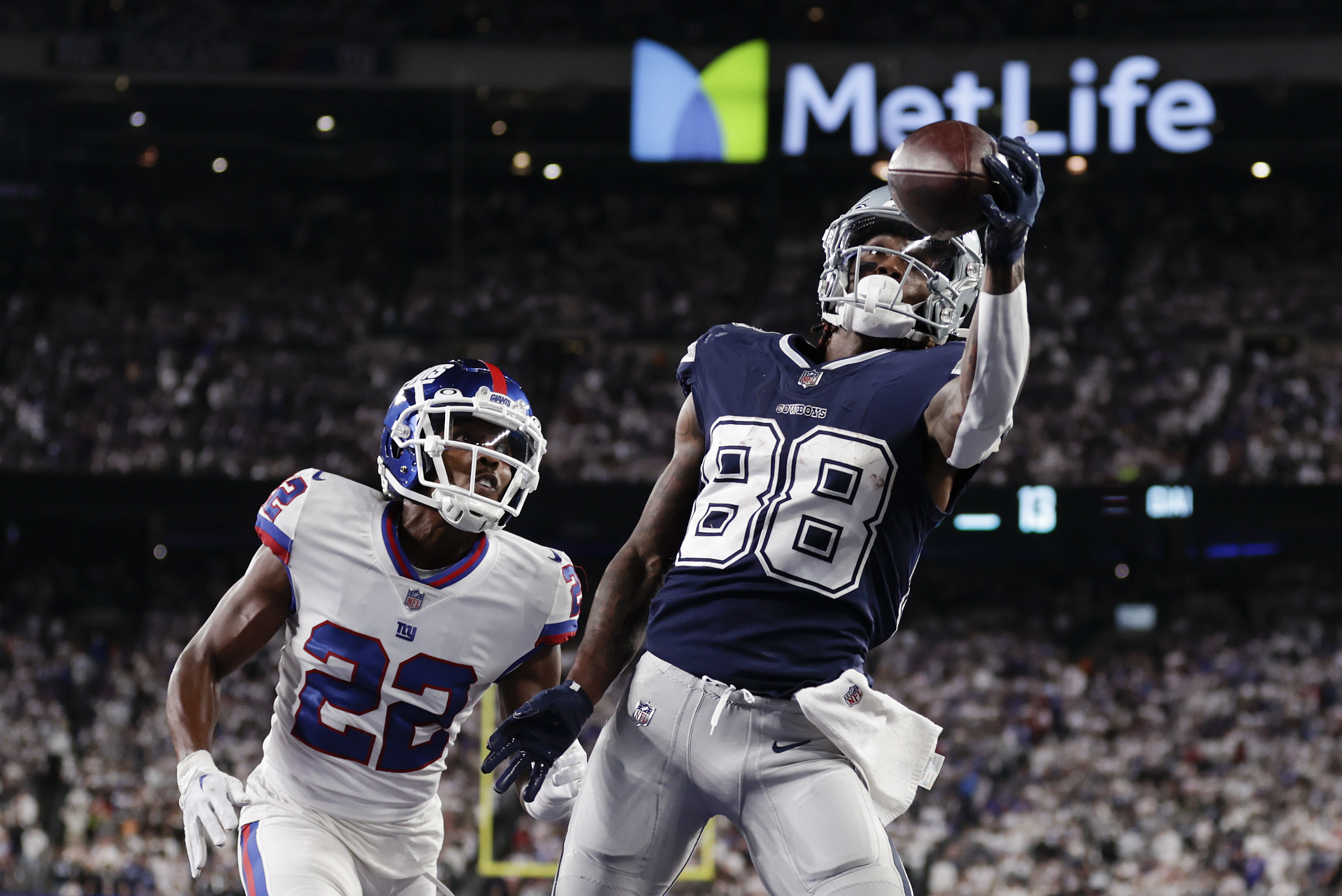 Dallas Cowboys wide receiver CeeDee Lamb (88) makes a catch in the end zone for a touchdown against New York Giants cornerback Adoree' Jackson (22) during the fourth quarter of an NFL football game, Monday, Sept. 26, 2022, in East Rutherford, N.J. 