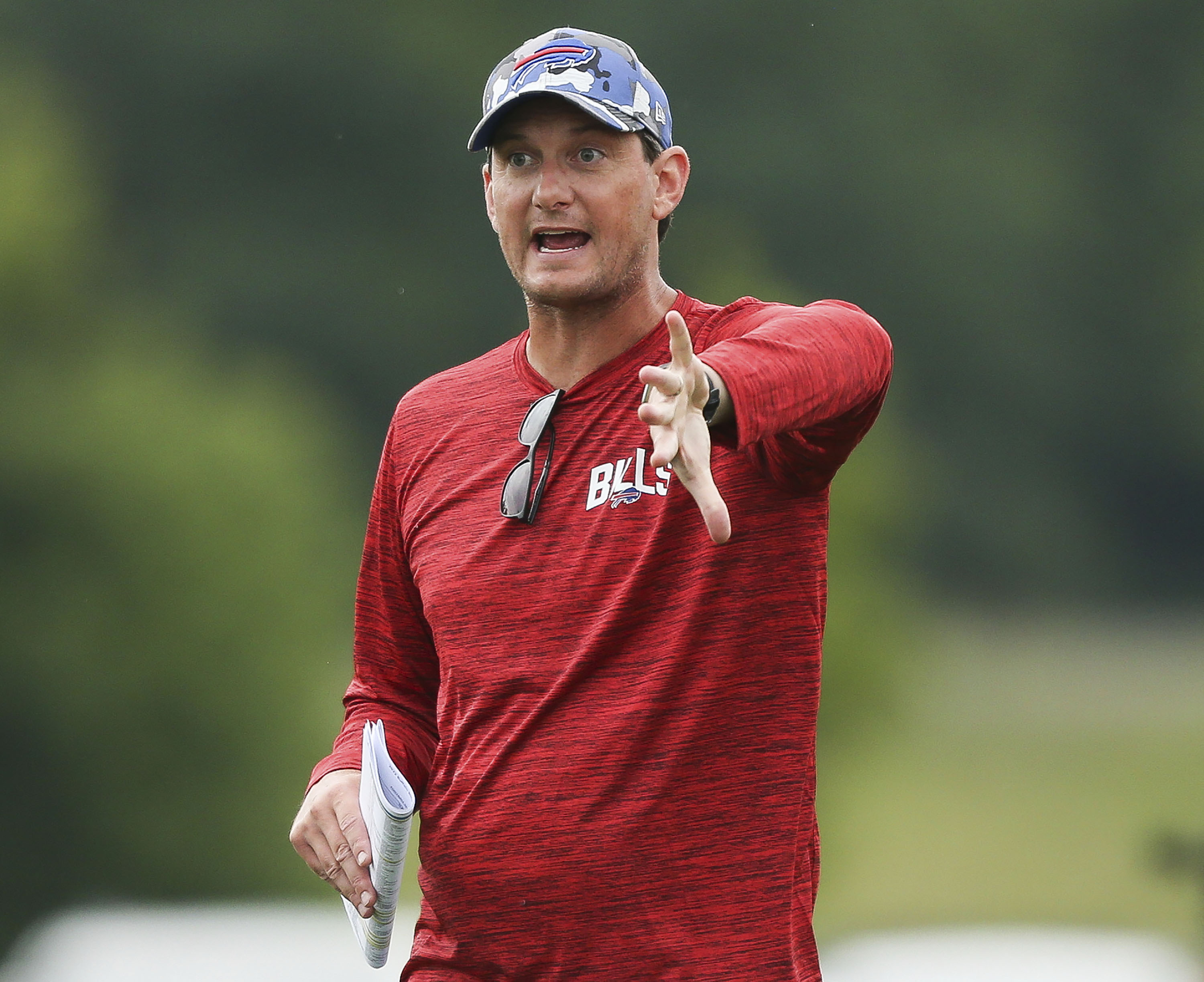FILE - Buffalo Bills offensive coordinator Ken Dorsey speaks to the wide receivers during practice at the NFL football team's training camp in Pittsford, N.Y., Aug. 4, 2022. Dorsey can appreciate a need to rein back his emotions after a video clip showed him in the visitors’ coaches booth ripping off his headset and violently bouncing it off the table, before trashing his game notes in the immediate aftermath of a 21-19 loss to the Miami Dolphins on Sunday, Sept. 25, 2022. 