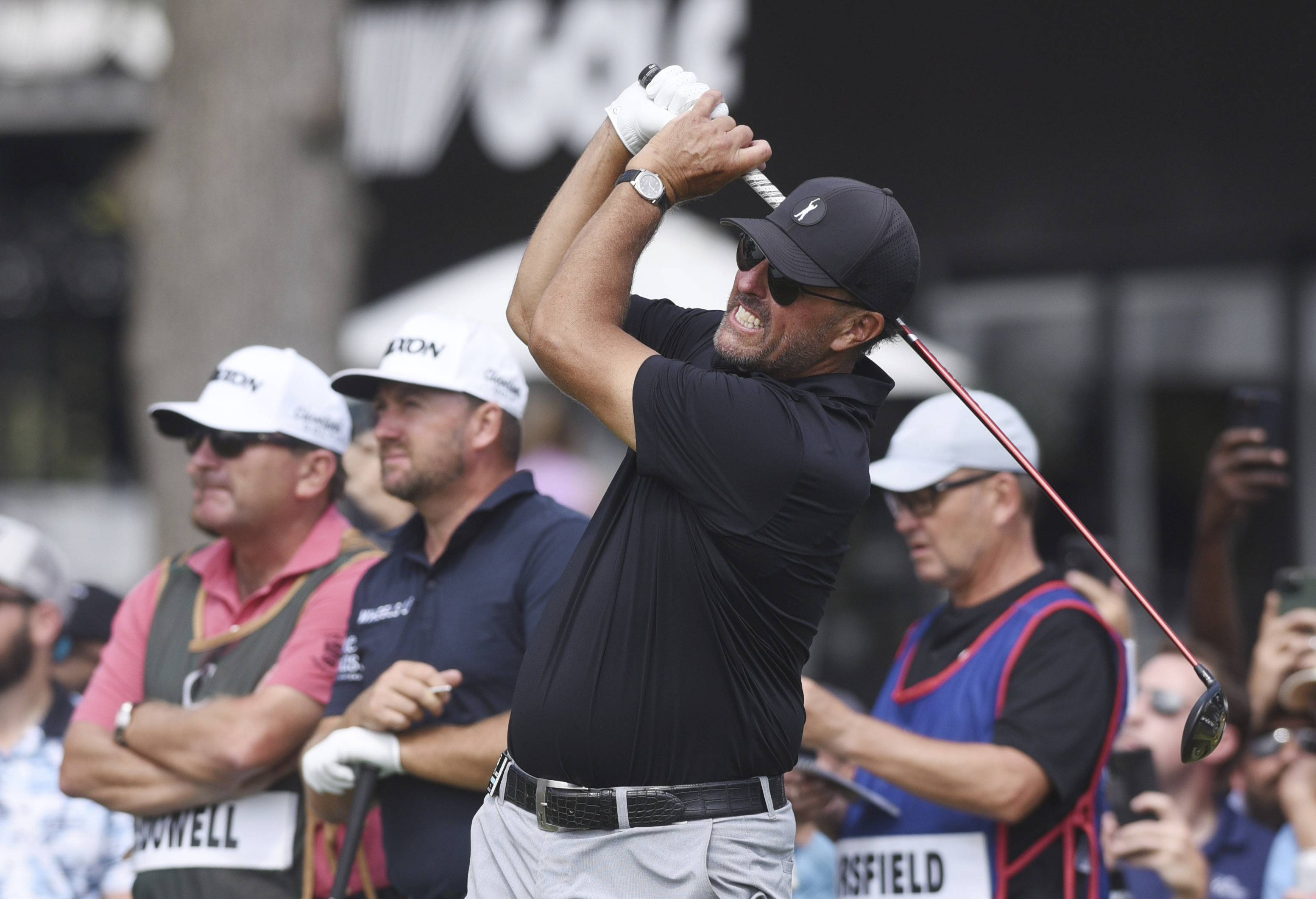 Phil Mickelson watches the flight of his tee shot on the first hole during the second round of the LIV Golf Invitational-Chicago tournament Saturday, Sept. 17, 2022, in Sugar Grove, Ill. 