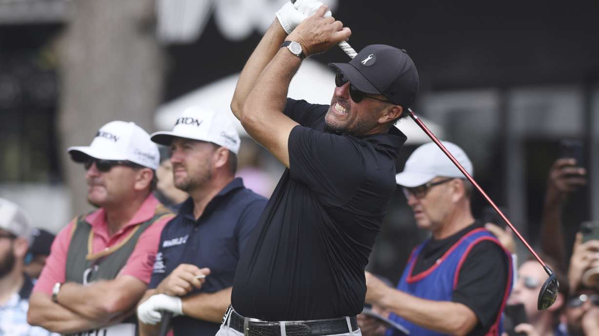 Phil Mickelson watches the flight of his tee shot on the first hole during the second round of the LIV Golf Invitational-Chicago tournament Saturday, Sept. 17, 2022, in Sugar Grove, Ill.