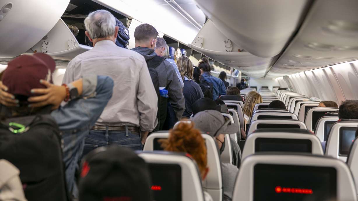 People exit an Air Canada after a flight in Mississauga, Ontario, Canada, on July 27. Canada’s COVID-19 travel restrictions will no longer be in place as of Oct. 1, government officials announced this week.