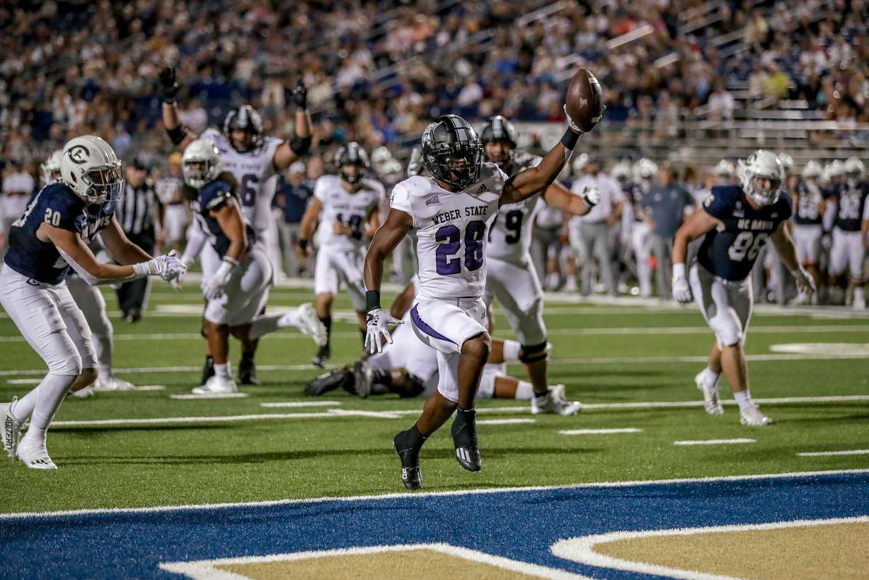 Weber State running back Dontae McMillan scores a touchdown against UC Davis in a game the Wildcats won, 17-12, on Sept. 24, 2022.