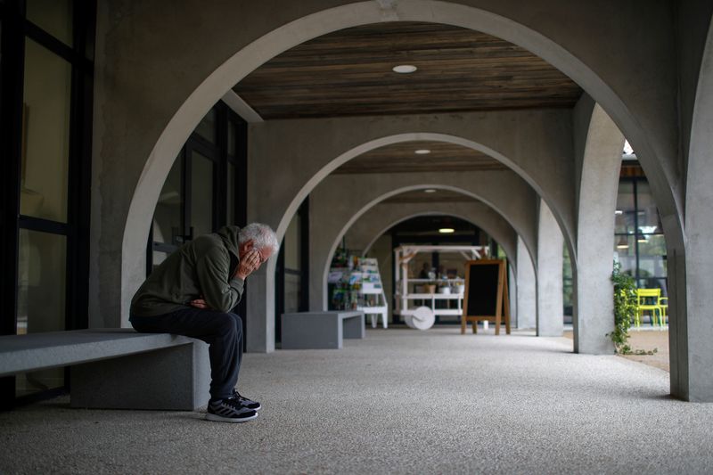 An Alzheimer's patient rests after a walk at the Village Landais Alzheimer site in Dax, France, Sept. 24, 2020. An experimental Alzheimer's drug slowed cognitive and functional decline in a large trial of patients in the early stages of the disease, the drug's makers said Tuesday.