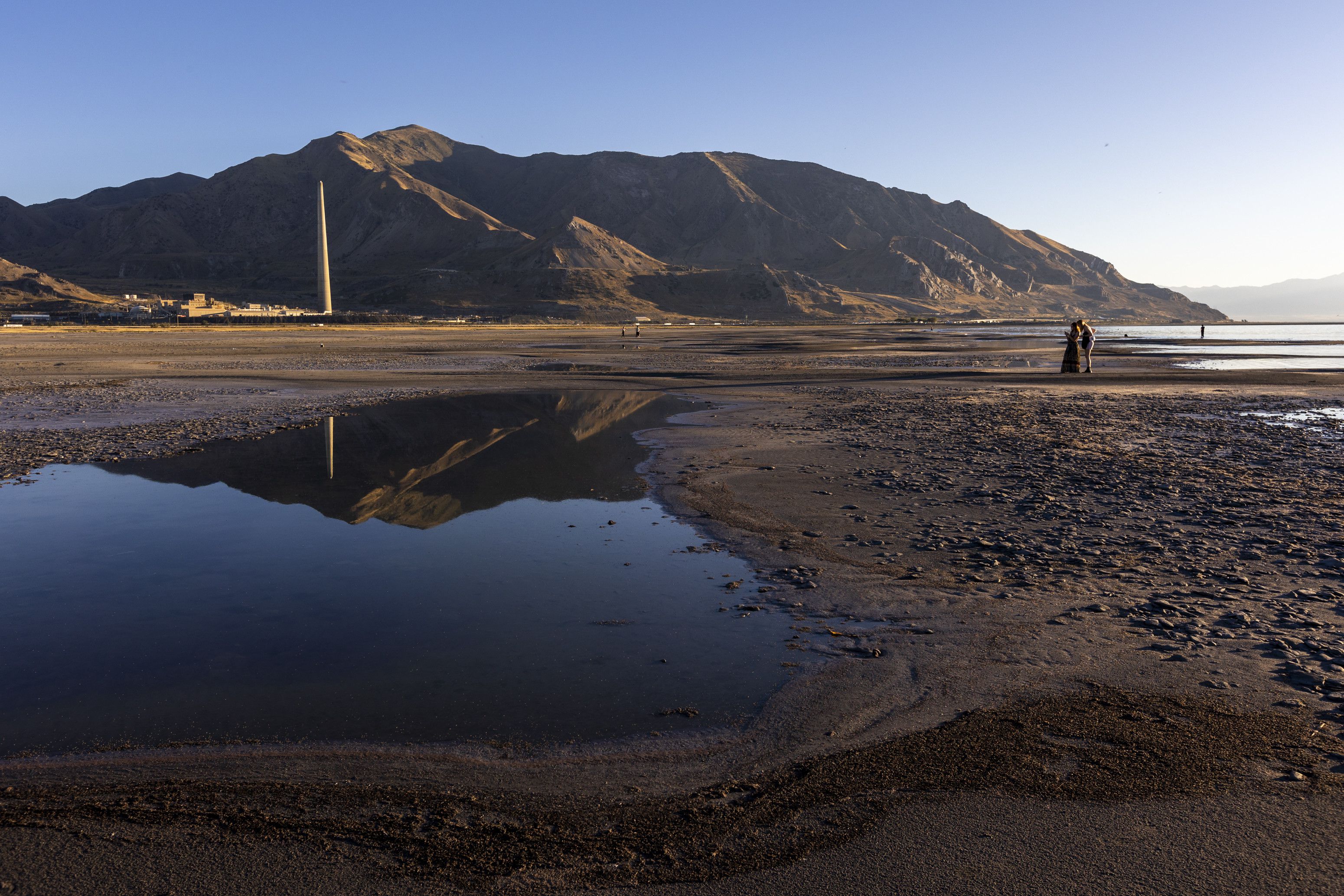 Izabel and Mary LePique take photos at the Great Salt Lake in Salt Lake City on Saturday.
