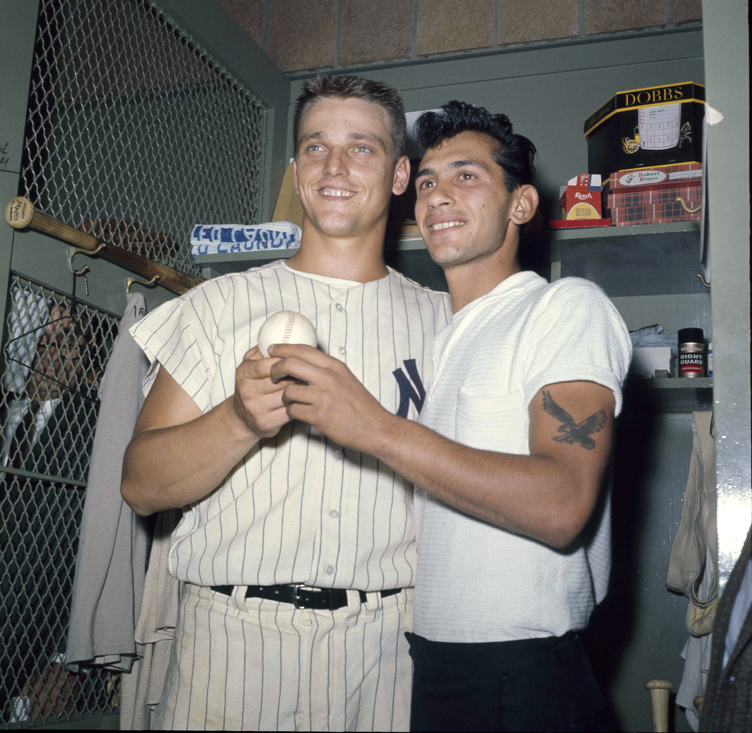 FILE - New York Yankees slugger Roger Maris poses with fan Sal Durante in the locker room at Yankee Stadium, Oct. 1, 1961, after hitting his 61st home run of the season. Durante caught Maris' fourth inning home run into the right field seats as Maris broke Babe Ruth's single-season home run record. If Aaron Judge passes Roger Maris, some lucky fan might become this generation's Sal Durante. 