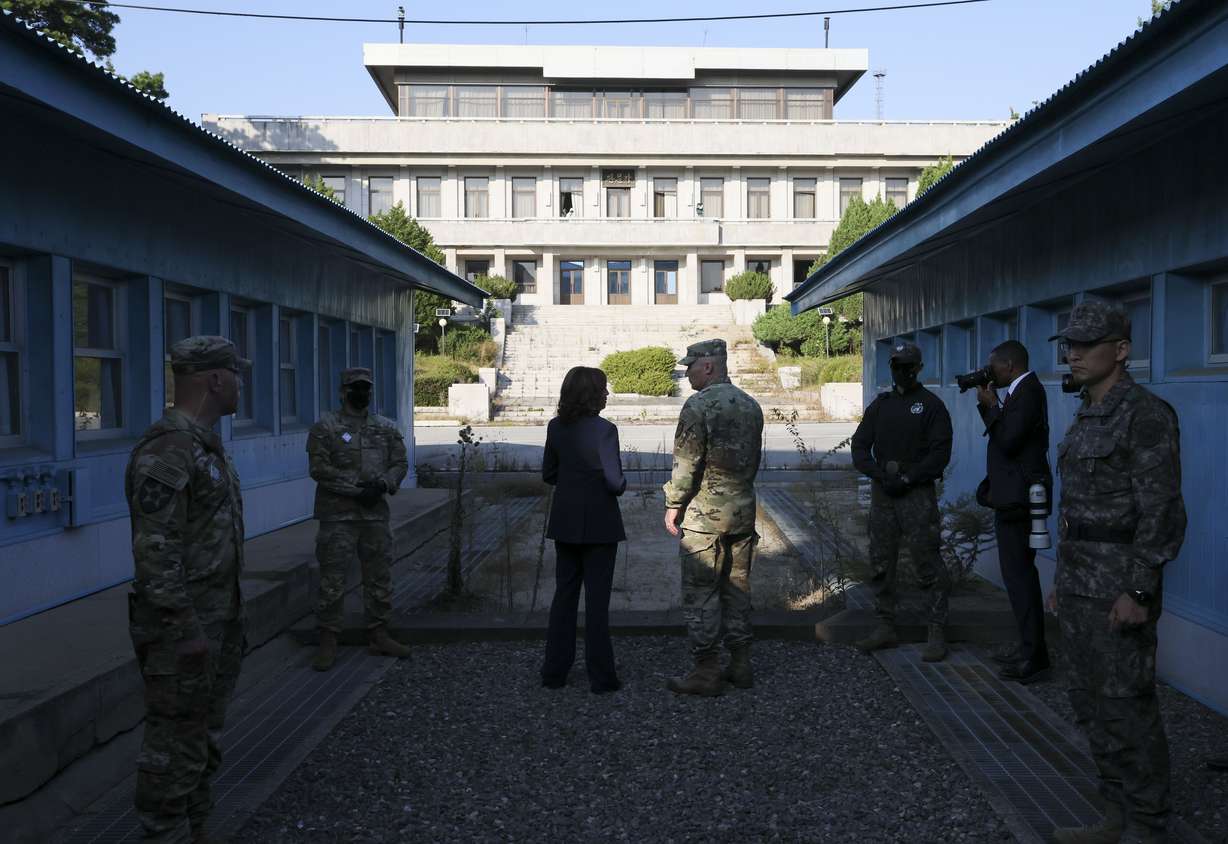 U.S. Vice President Kamala Harris, center left, stands next to the demarcation line at the demilitarized zone separating the two Koreas, in Panmunjom, South Korea Thursday.