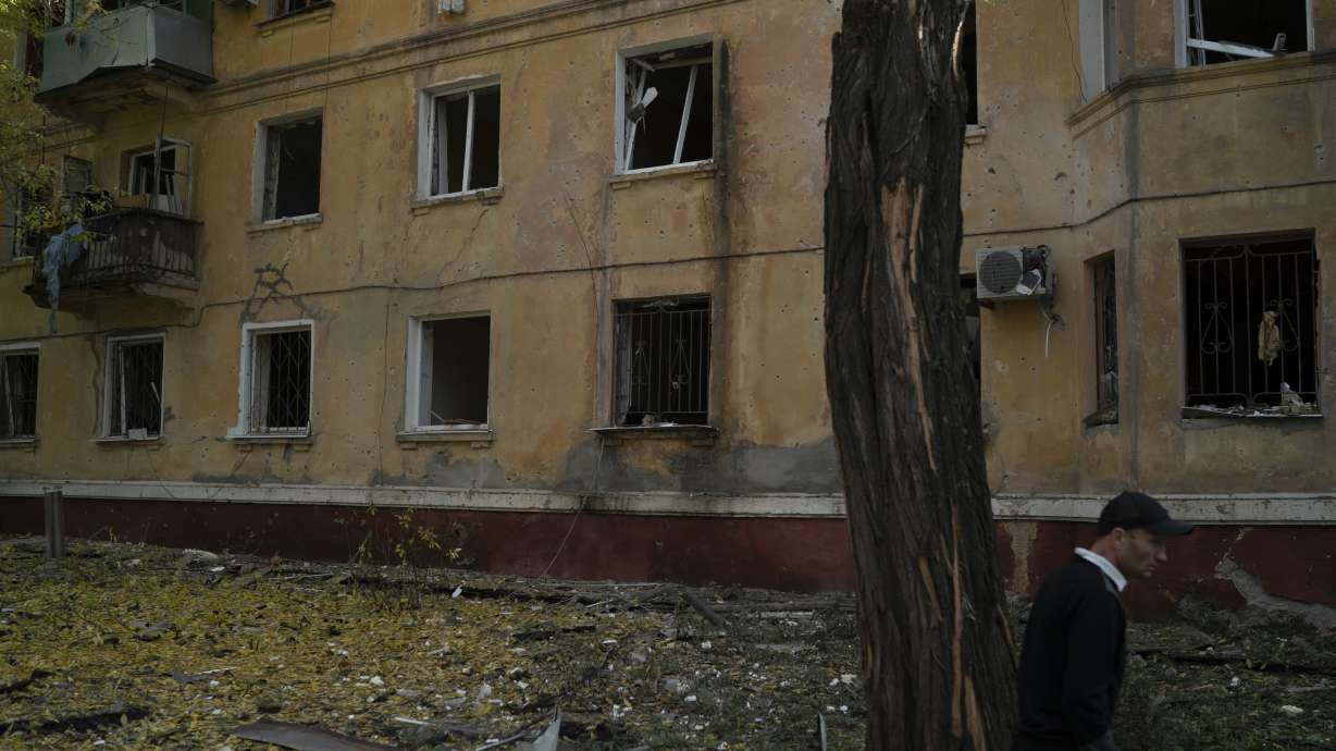 A man walks past a damaged building after a Russian attack in Kramatorsk, Ukraine, Thursday. Russia is planning to annex more of Ukraine on Friday.