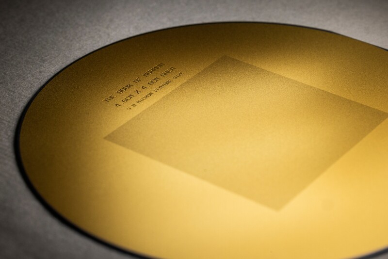 A minuscule Book of Mormon was microscopically engraved on a thin silicon disc by BYU students.