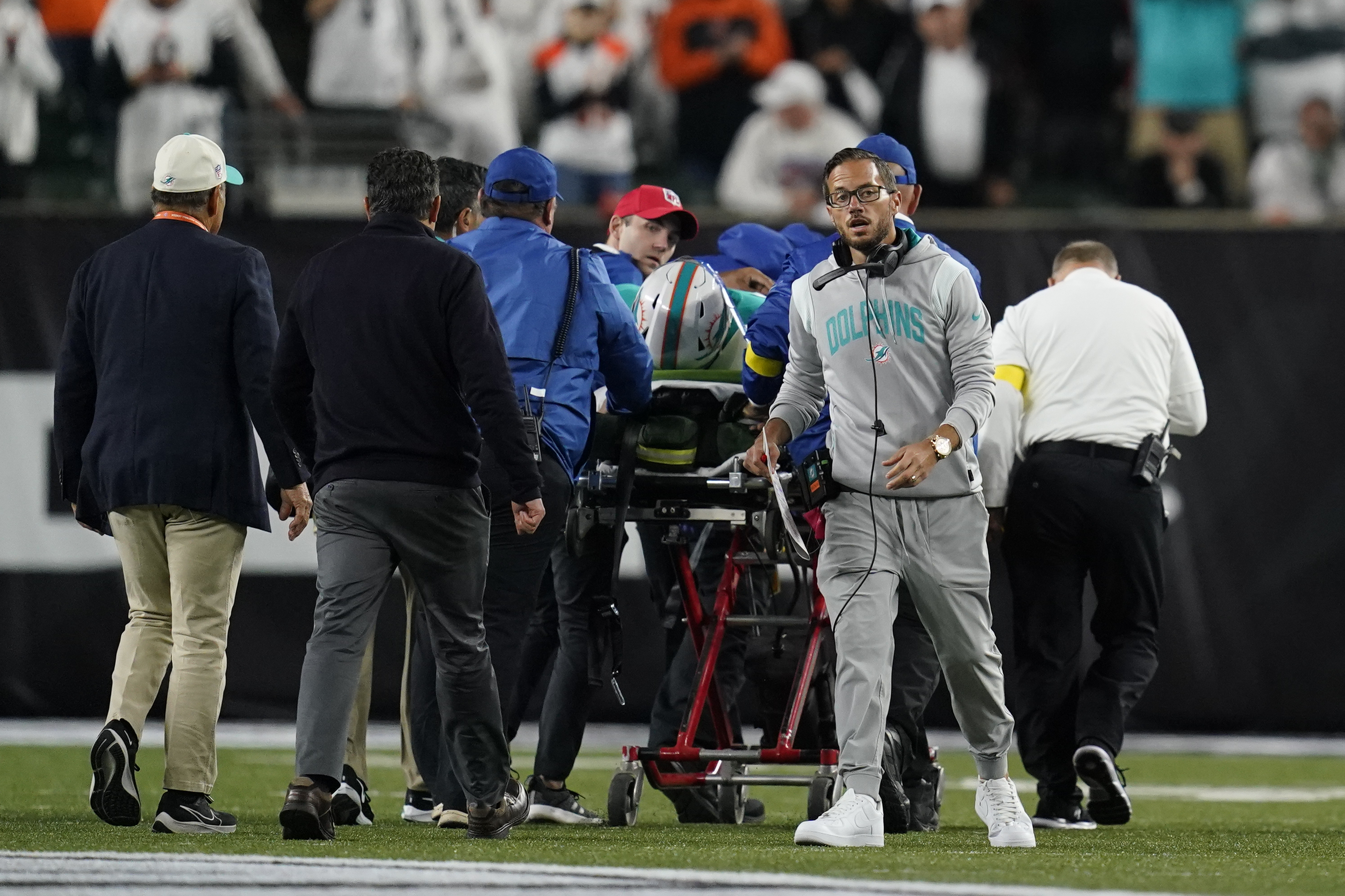 Miami Dolphins head coach Mike McDaniel walks away as quarterback Tua Tagovailoa is taken off the field on a stretcher during the first half of an NFL football game against the Cincinnati Bengals, Thursday, Sept. 29, 2022, in Cincinnati. 