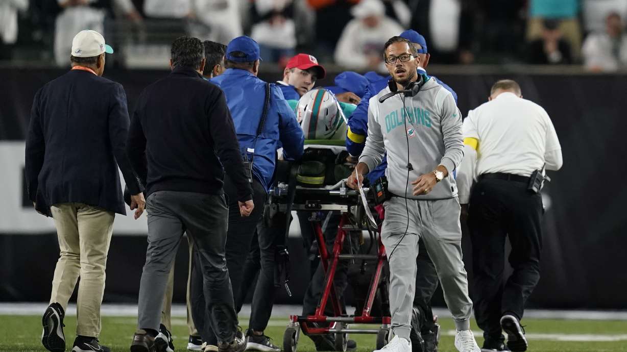 Miami Dolphins head coach Mike McDaniel walks away as quarterback Tua Tagovailoa is taken off the field on a stretcher during the first half of an NFL football game against the Cincinnati Bengals, Thursday, Sept. 29, 2022, in Cincinnati.