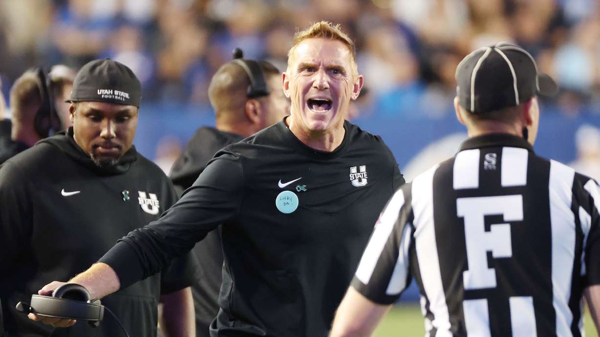 Utah State Aggies head coach Blake Anderson yells at the ref in Provo on Thursday, Sept. 29, 2022.