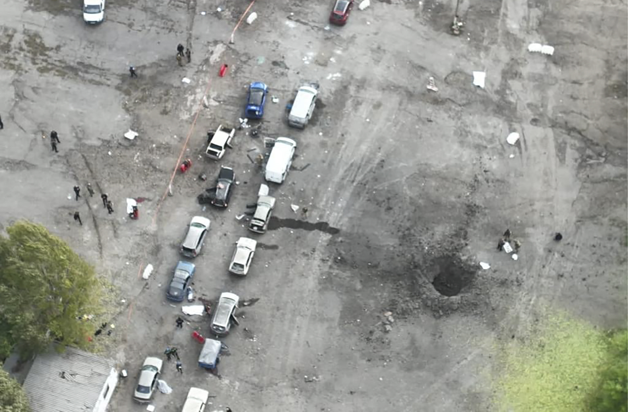 In this image released by the Police Press Service, the view from a drone shows the site of a Russian rocket attack in Zaporizhzhia, Ukraine, Friday. A Russian strike on the Ukrainian city of Zaporizhzhia killed at least 23 people and wounded dozens, an official said Friday.