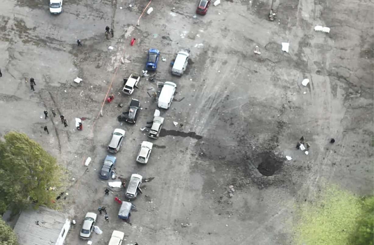 In this image released by the Police Press Service, the view from a drone shows the site of a Russian rocket attack in Zaporizhzhia, Ukraine, Friday. A Russian strike on the Ukrainian city of Zaporizhzhia killed at least 23 people and wounded dozens, an official said Friday.