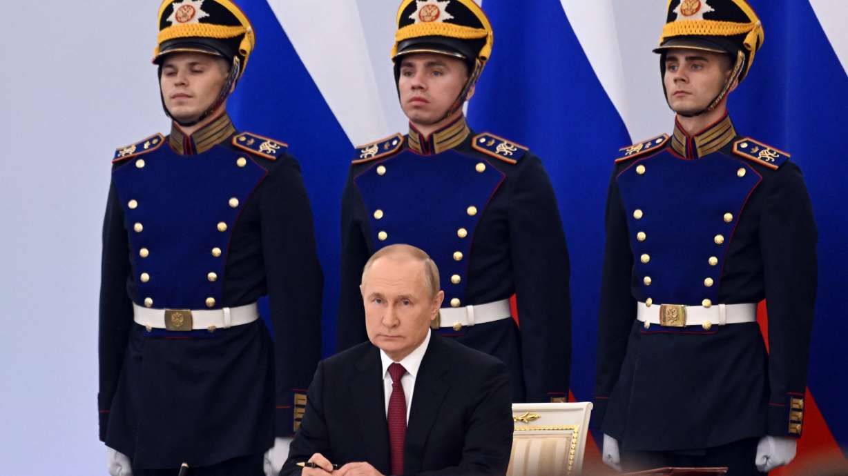 Russian President Vladimir Putin attends a ceremony to sign the treaties for four Donetsk and Luhansk regions of Ukraine to join Russia in the Kremlin in Moscow, Russia, Friday.