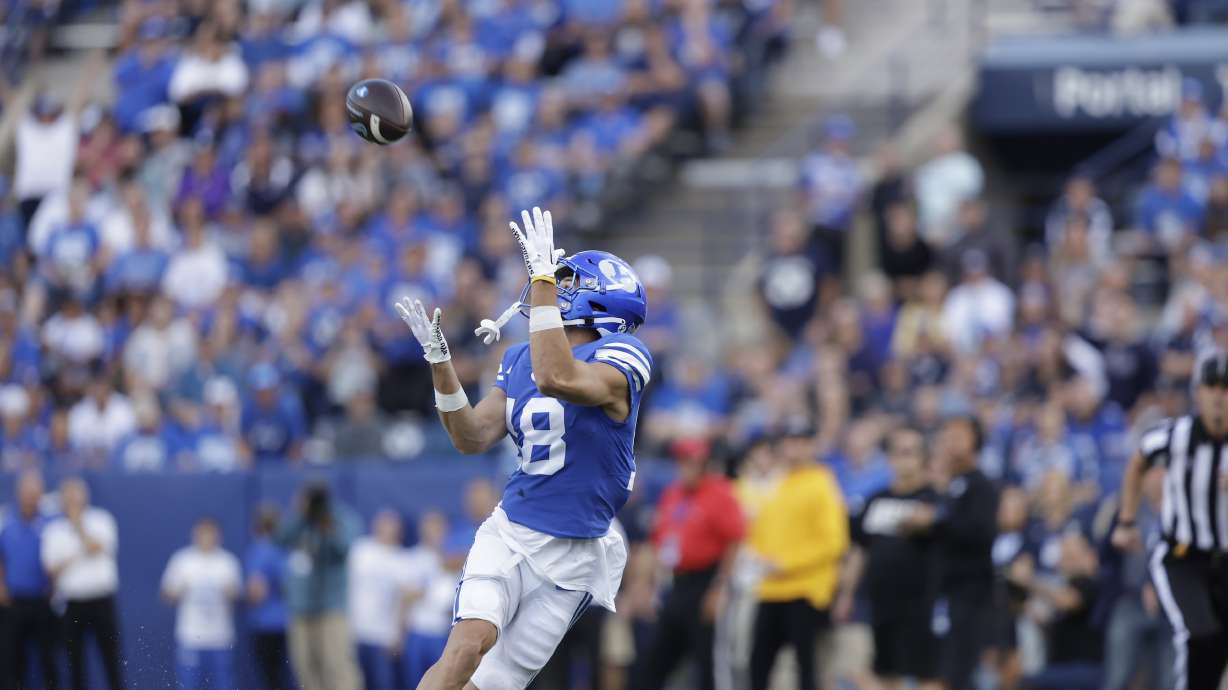 BYU wide receiver Gunner Romney hauls in a 34-yard catch on the Cougars' first offensive play of the game during a 38-26 win over in-state rival Utah State, Thursday, Sept. 29, 2022 at LaVell Edwards Stadium in Provo.