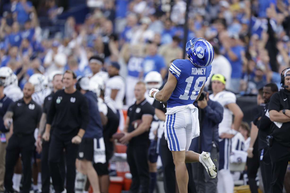 BYU wide receiver Gunner Romney screams after making a 34-yard catch on the Cougars' first offensive play of the game during a 38-26 win over in-state rival Utah State, Thursday, Sept. 29, 2022 at LaVell Edwards Stadium in Provo.