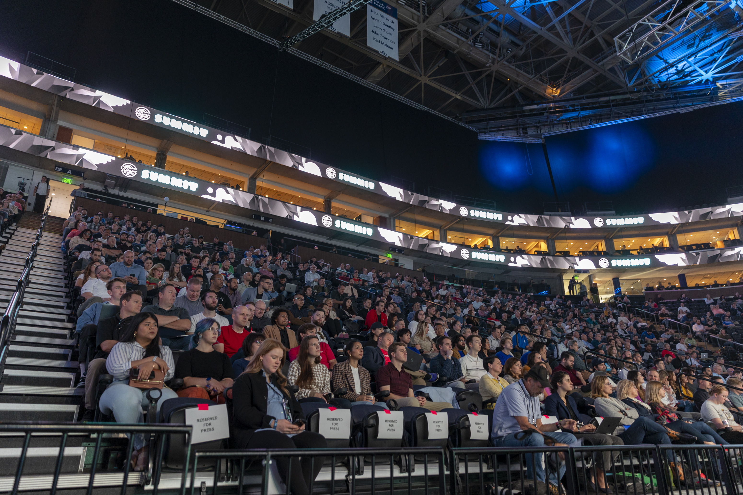 Attendees listen to Pluralsight co-founder and CEO Aaron Skonnard speaking during the Silicon Slopes Summit at the Vivint Arena in Salt Lake City on Friday.