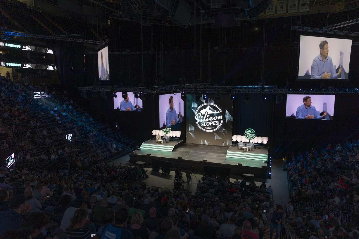 John Bowers, left, director of partnerships at Silicon Slopes, interviews Steve Young, former BYU and NFL quarterback, during the Silicon Slopes Summit at Vivint Arena in Salt Lake City on Friday.