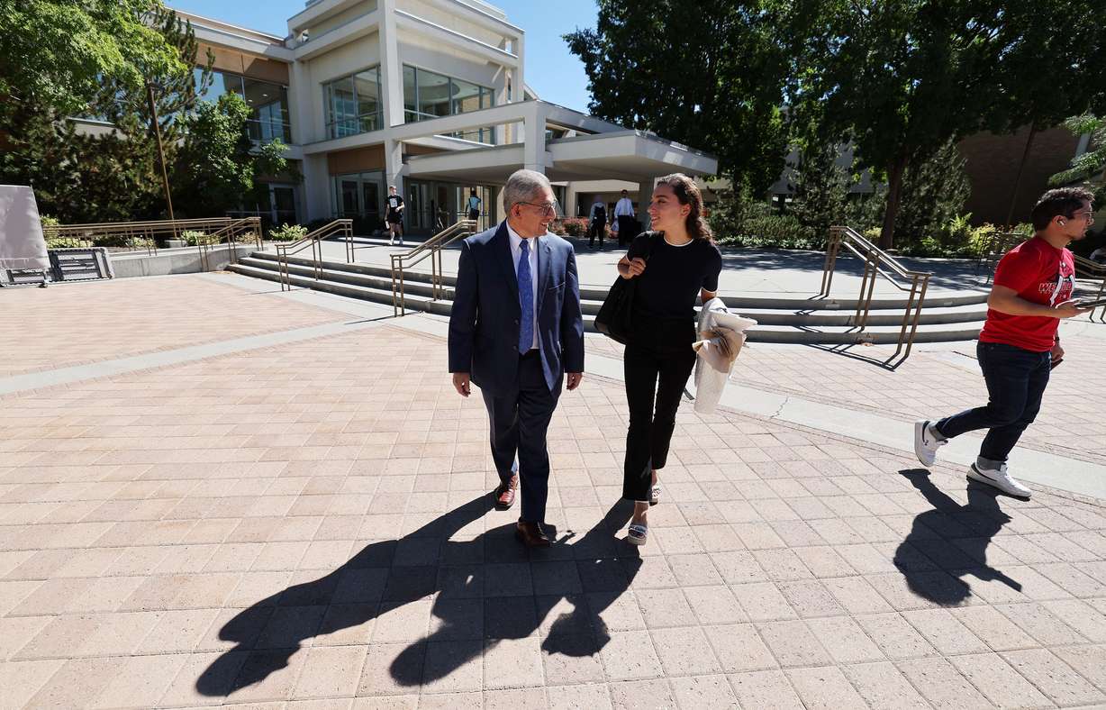 Carl Hernandez talks with Eliza Florence Arts as they walk on campus at BYU on Sept. 19. Hernandez is BYU’s new vice president of belonging for the new Office of Belonging, which is designed to address prejudice issues in the campus community.