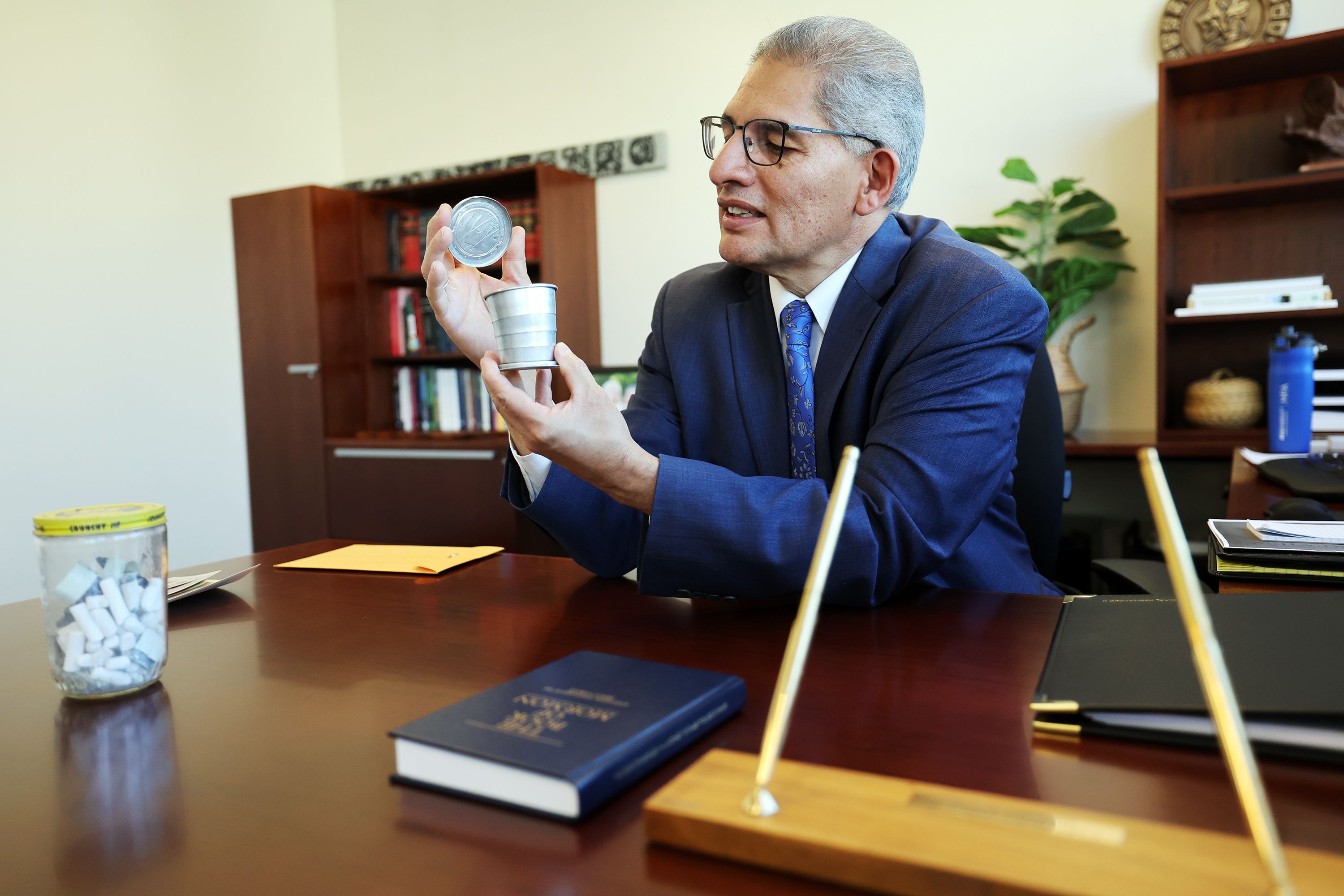 Carl Hernandez shows a small metal cup that his mother would give him water in while he worked in the fields, on Sept. 19. Hernandez is BYU’s new vice president of belonging for the new Office of Belonging, which is designed to address prejudice issues in the campus community.
