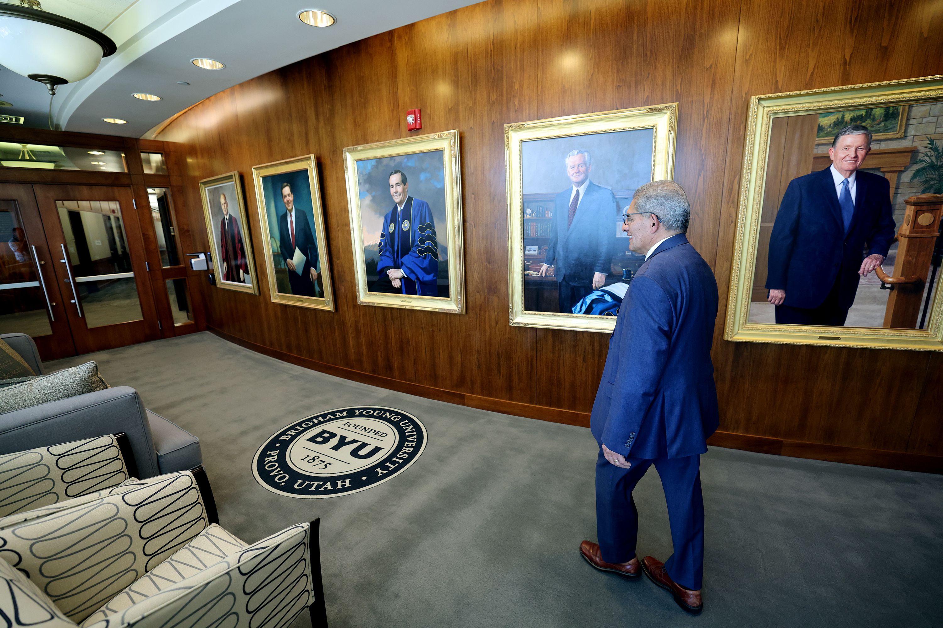 Carl Hernandez walks to his office inside the Smoot Administration Building on campus at Brigham Young University on Sept. 19.
